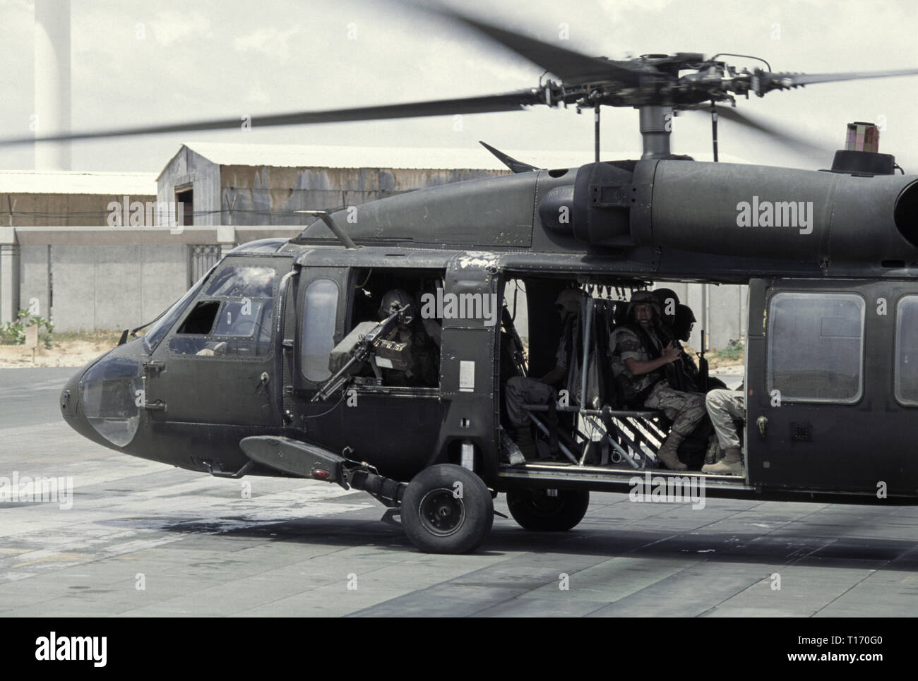 29th October 1993 U.S. Army soldiers on board a US Army Sikorsky UH-60 Black Hawk helicopter, ready fro take-off from the UNOSOM headquarters compound in Mogadishu, Somalia. Stock Photo
