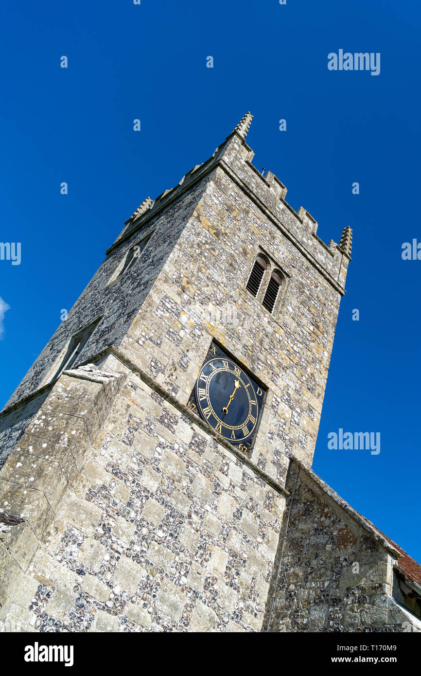 Church tower with clock against blue sky Stock Photo