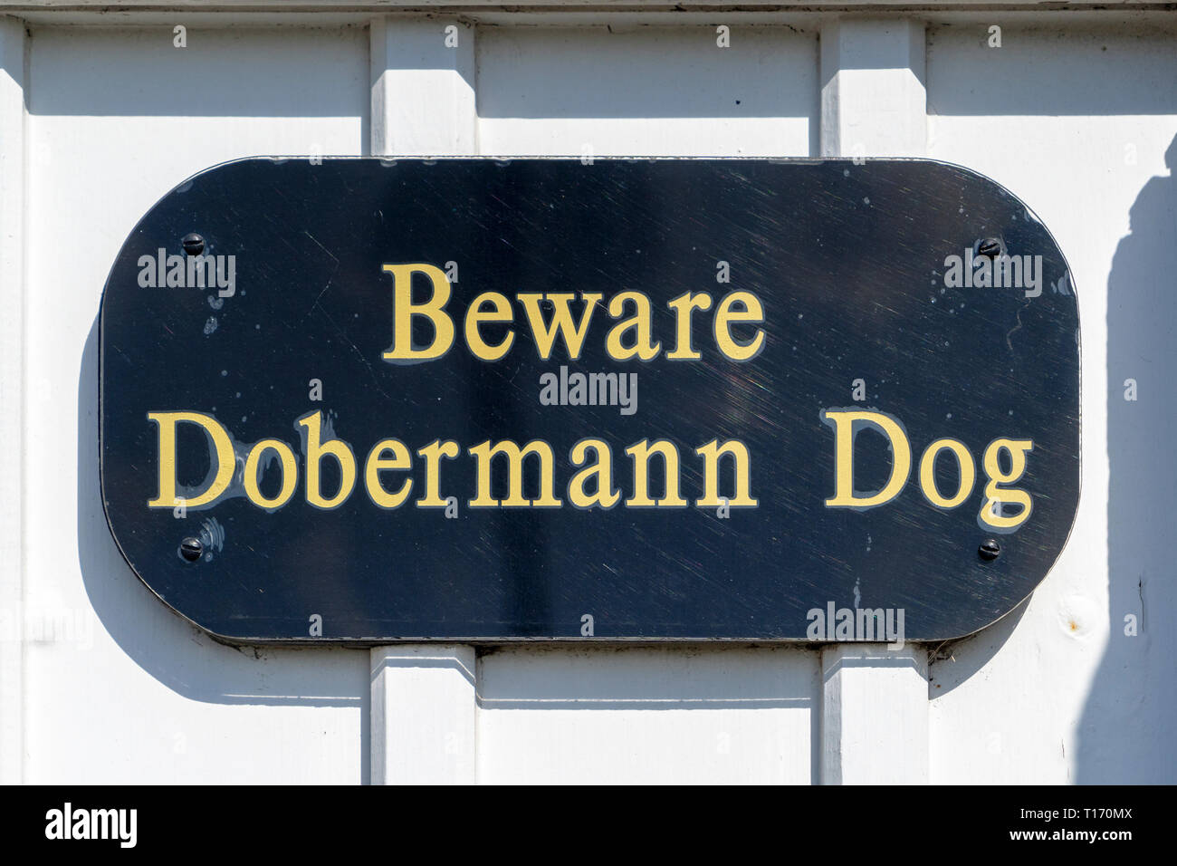 Beware Doberman dog sign Stock Photo