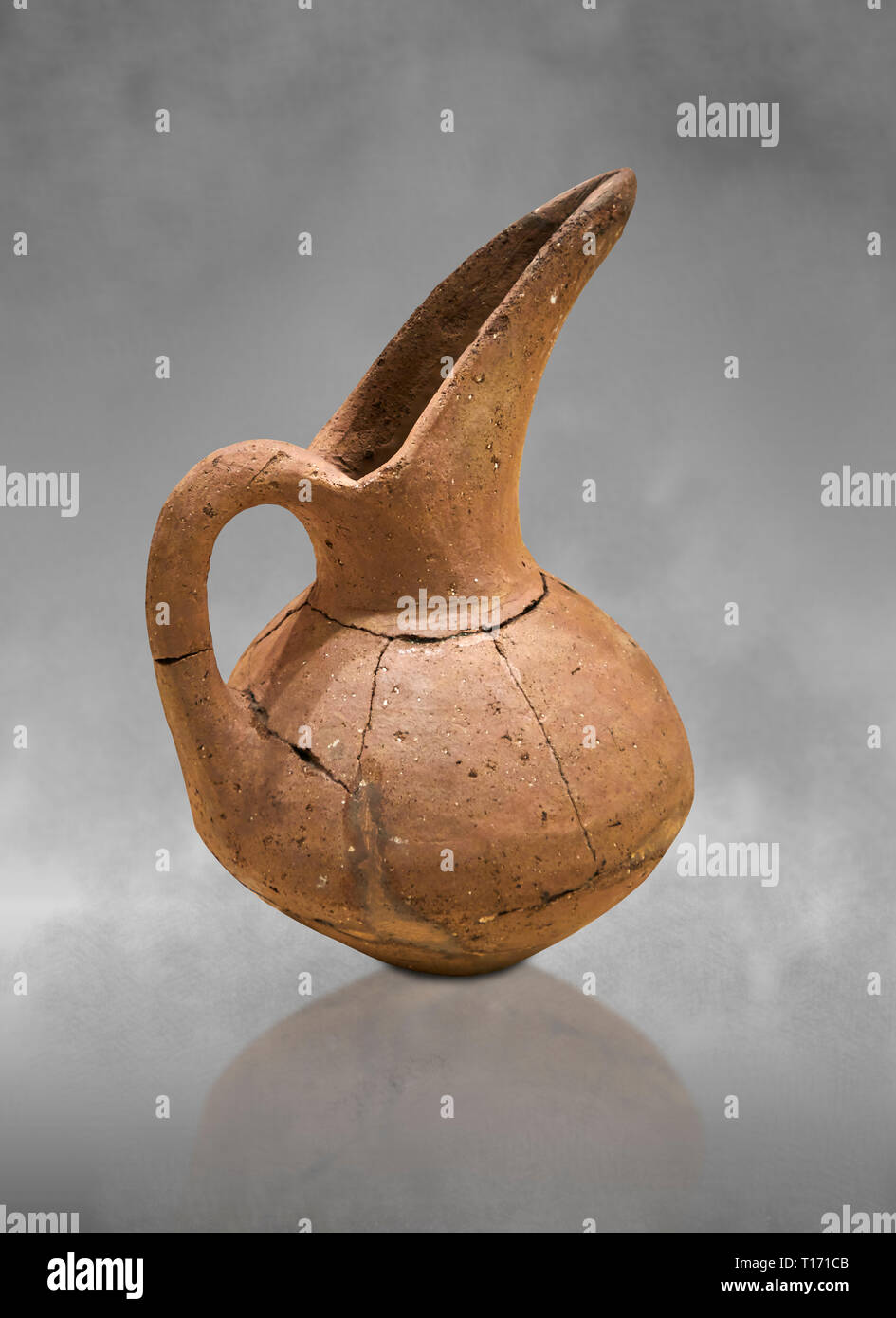 Hittite terra cotta beak spout pitcher . Hittite Period, 1600 - 1200 BC.  Hattusa Boğazkale. Çorum Archaeological Museum, Corum, Turkey. Against a gre Stock Photo