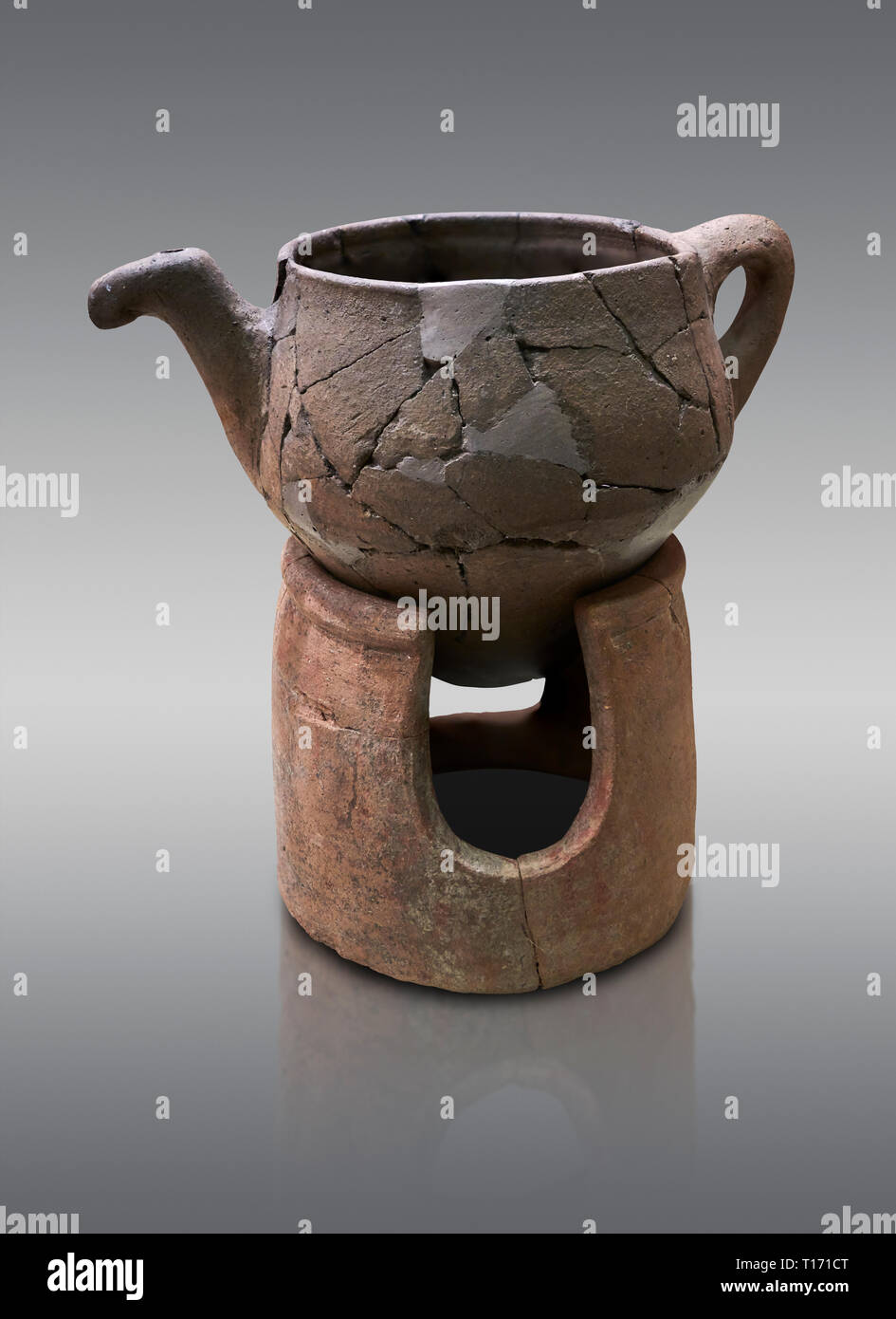 Hittite terra cotta teapot with strainer spout on a charcoa; burner base  . Hittite Period, 1600 - 1200 BC.  Hattusa Boğazkale. Çorum Archaeological M Stock Photo