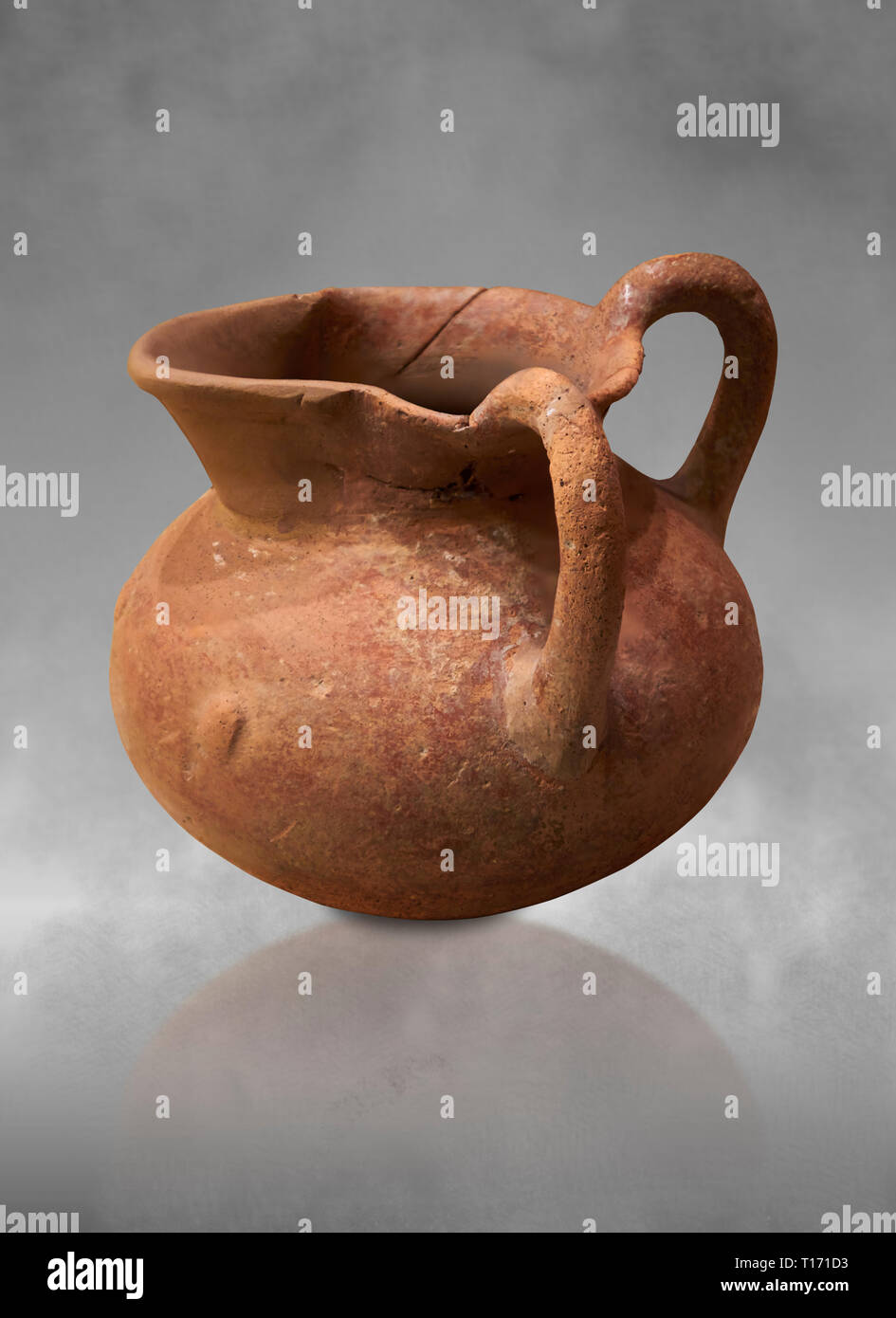 Hittite terra cotta two handled pitcher. Hittite Period, 1600 - 1200 BC.  Hattusa Boğazkale. Çorum Archaeological Museum, Corum, Turkey. Against a gre Stock Photo