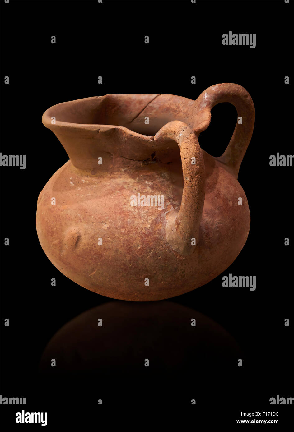 Hittite terra cotta two handled pitcher. Hittite Period, 1600 - 1200 BC.  Hattusa Boğazkale. Çorum Archaeological Museum, Corum, Turkey. Against a bla Stock Photo