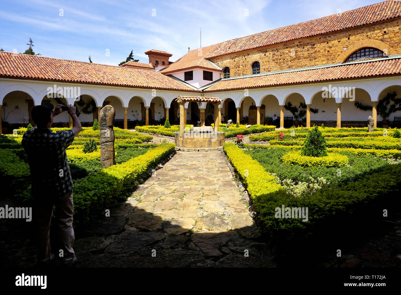 Shadow Man taking a Picture in the Courtyard of Ecce Homo Monastery, Villa de Leyva, Colombia Stock Photo