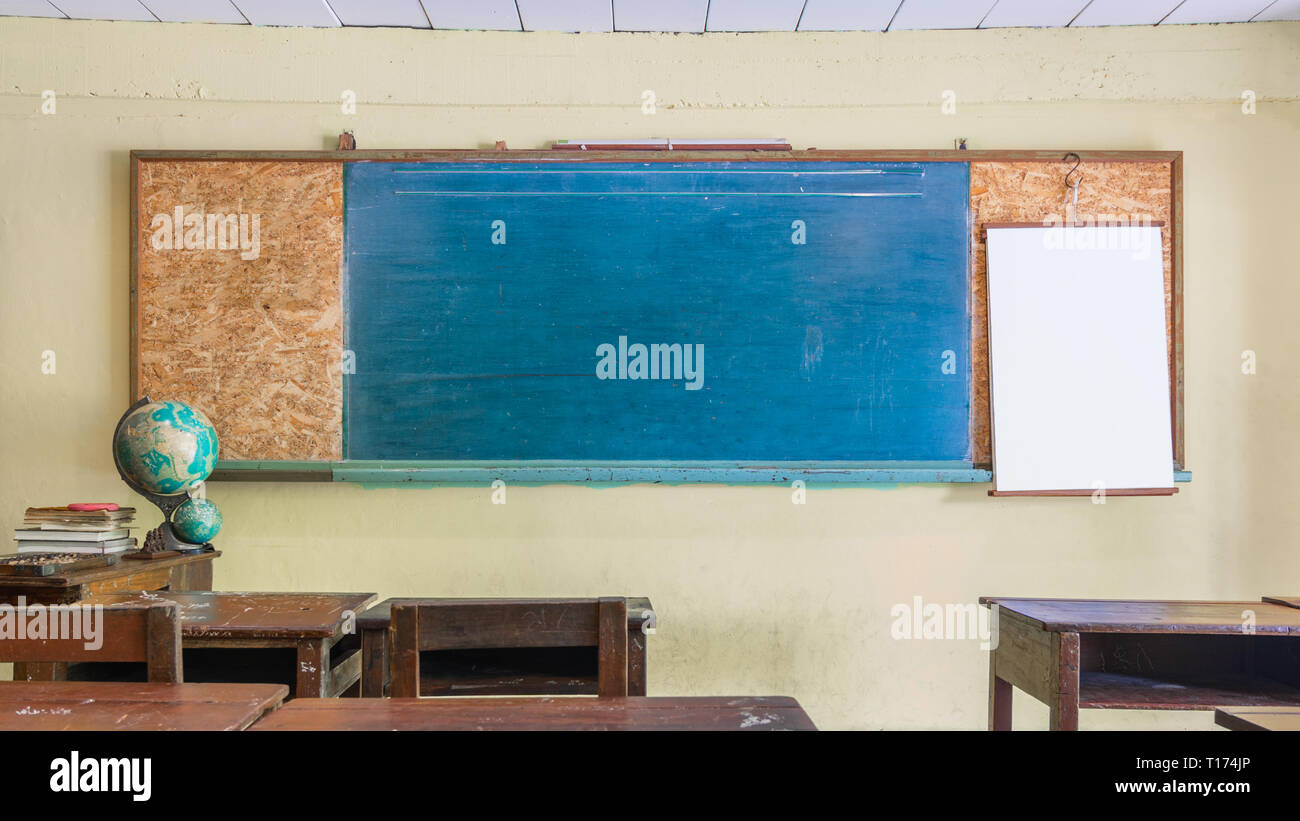 Vintage retro classroom interior with empty chalkboard for your copy