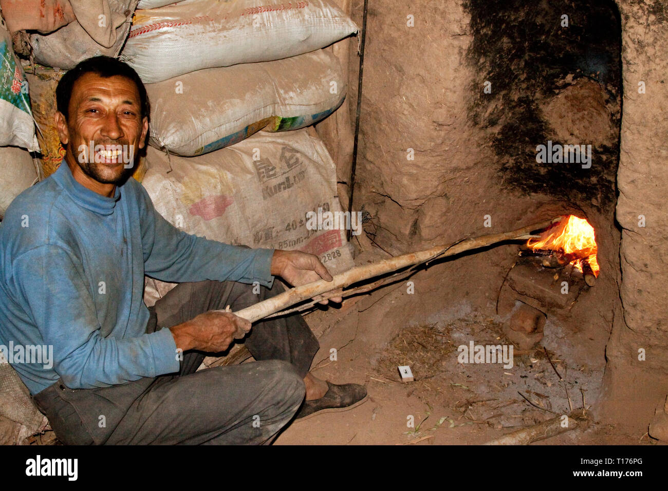 Making fire. Old town, Kashgar, Xinjiang Autonomous Region, China. Stock Photo