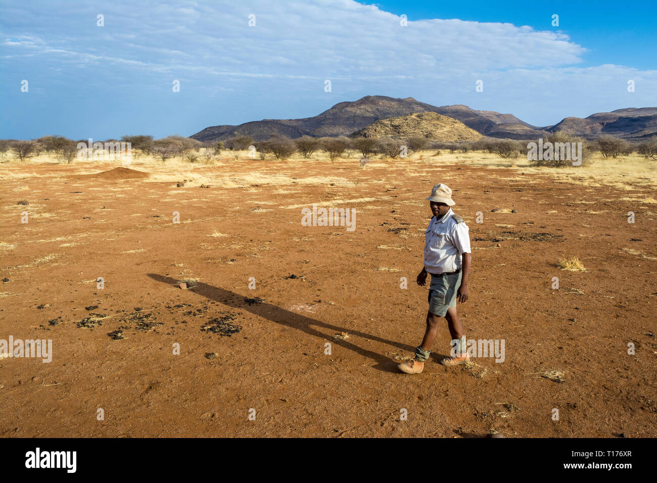 tourist guide on th field, Namibia Stock Photo Alamy