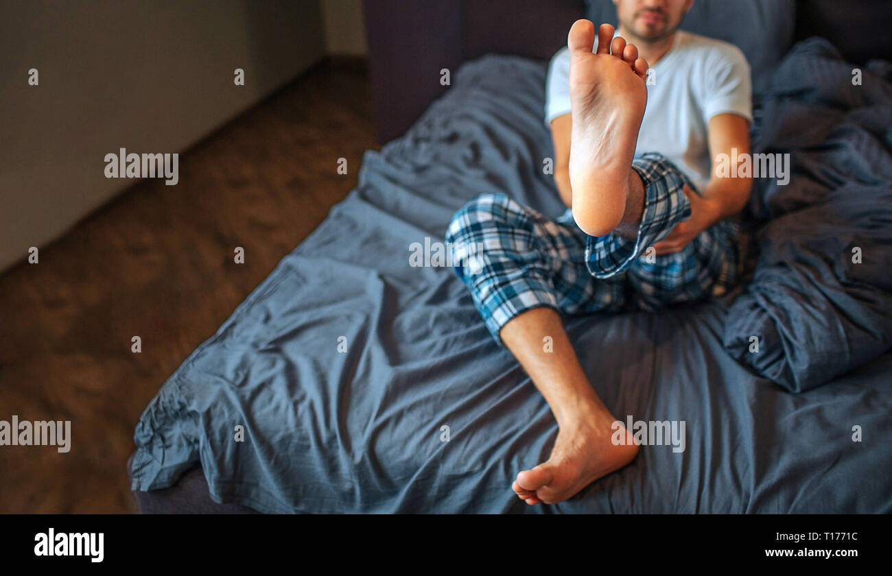 Man Sits On Glass Jar