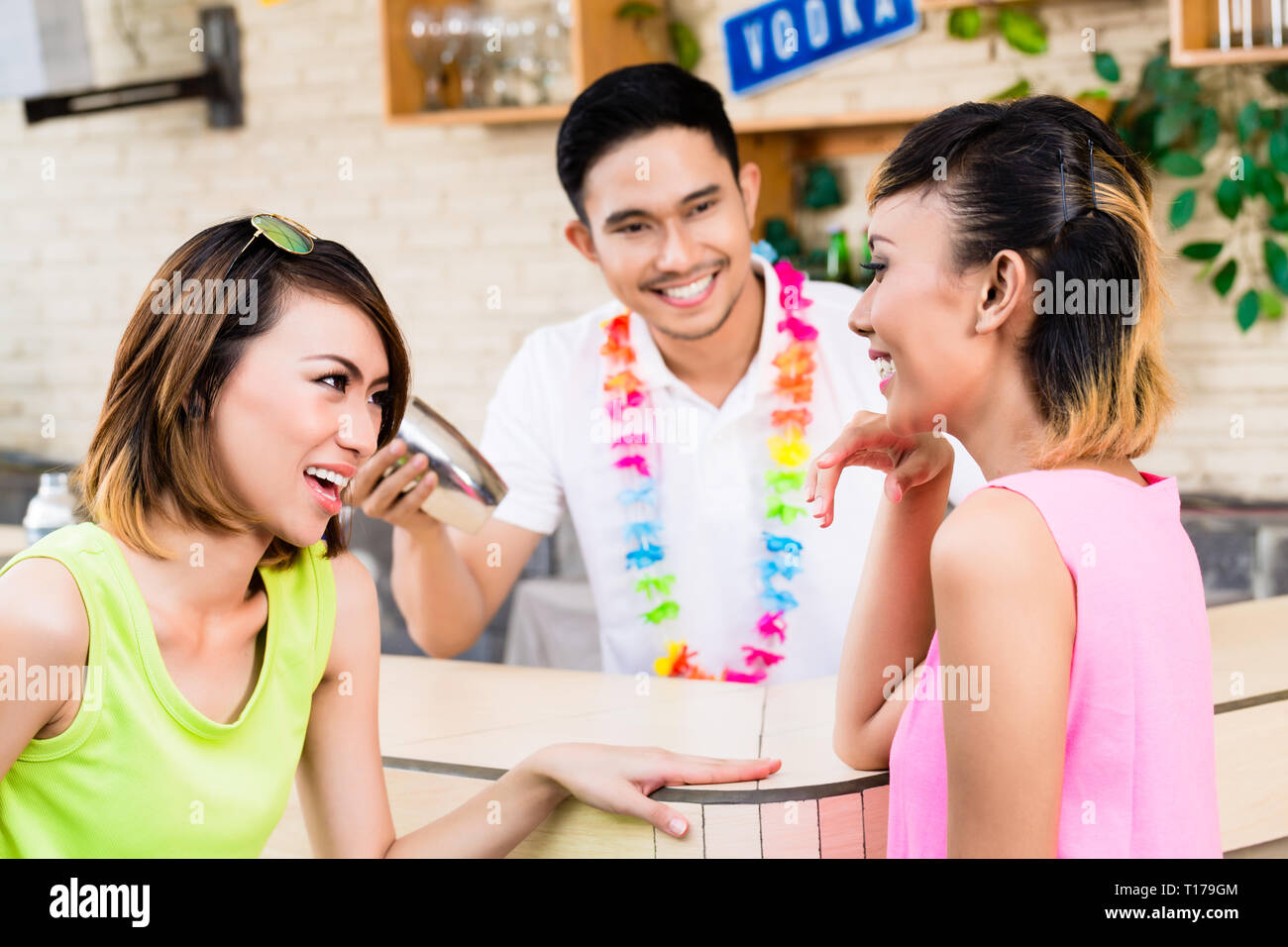 Smiling women at barcounter Stock Photo