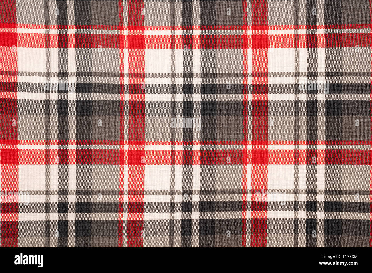 Tartan plaid natural cotton fabric. Seamless tiles texture for the background. Stock Photo