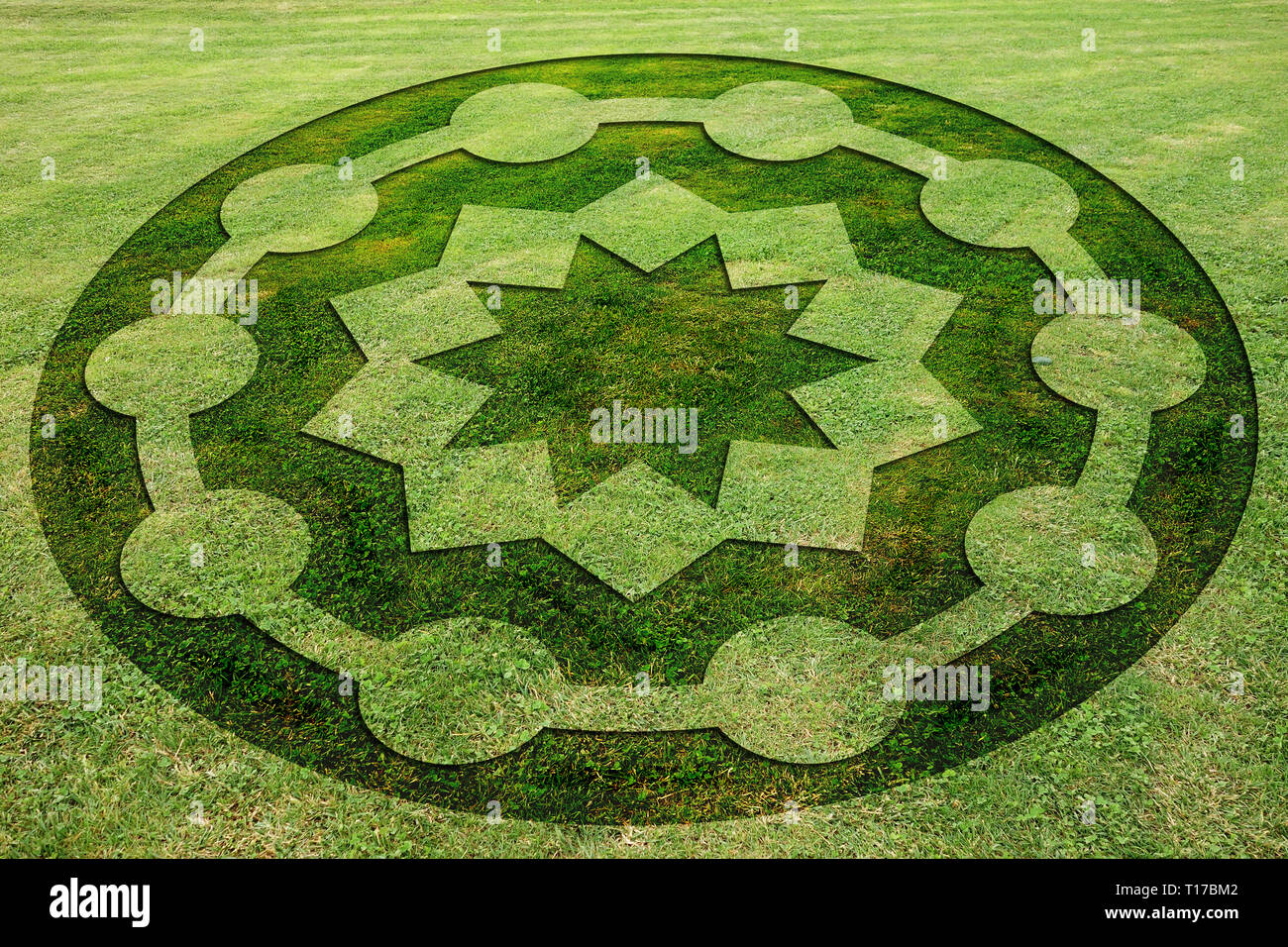 Concentric circles and stars symbols fake crop circle in the meadow Stock Photo
