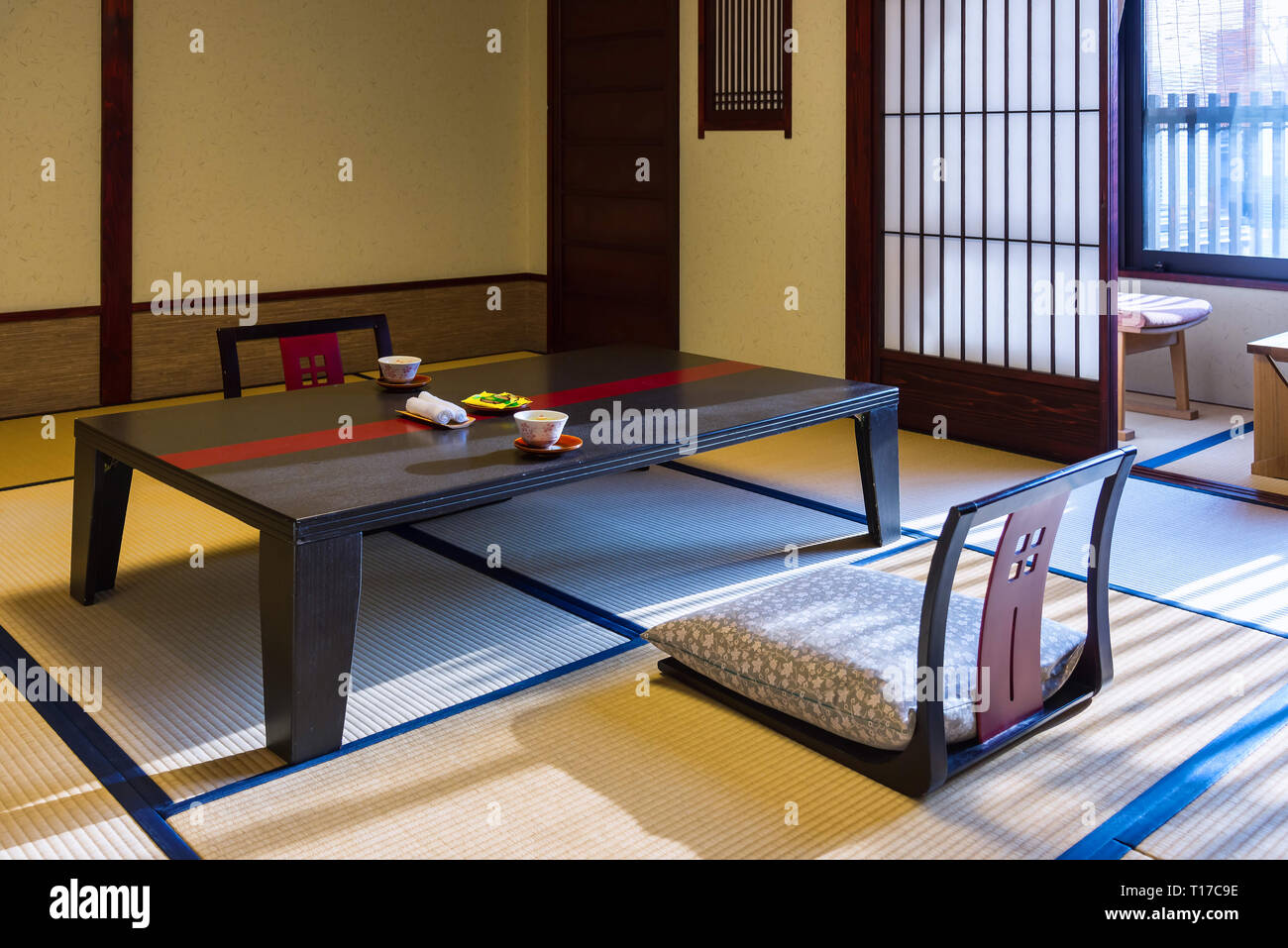 Takayama, Japan - April 25, 2014: The room interior of a ryokan. A ryokan  is a type of traditional Japanese inn that typically feature tatami rooms Stock Photo