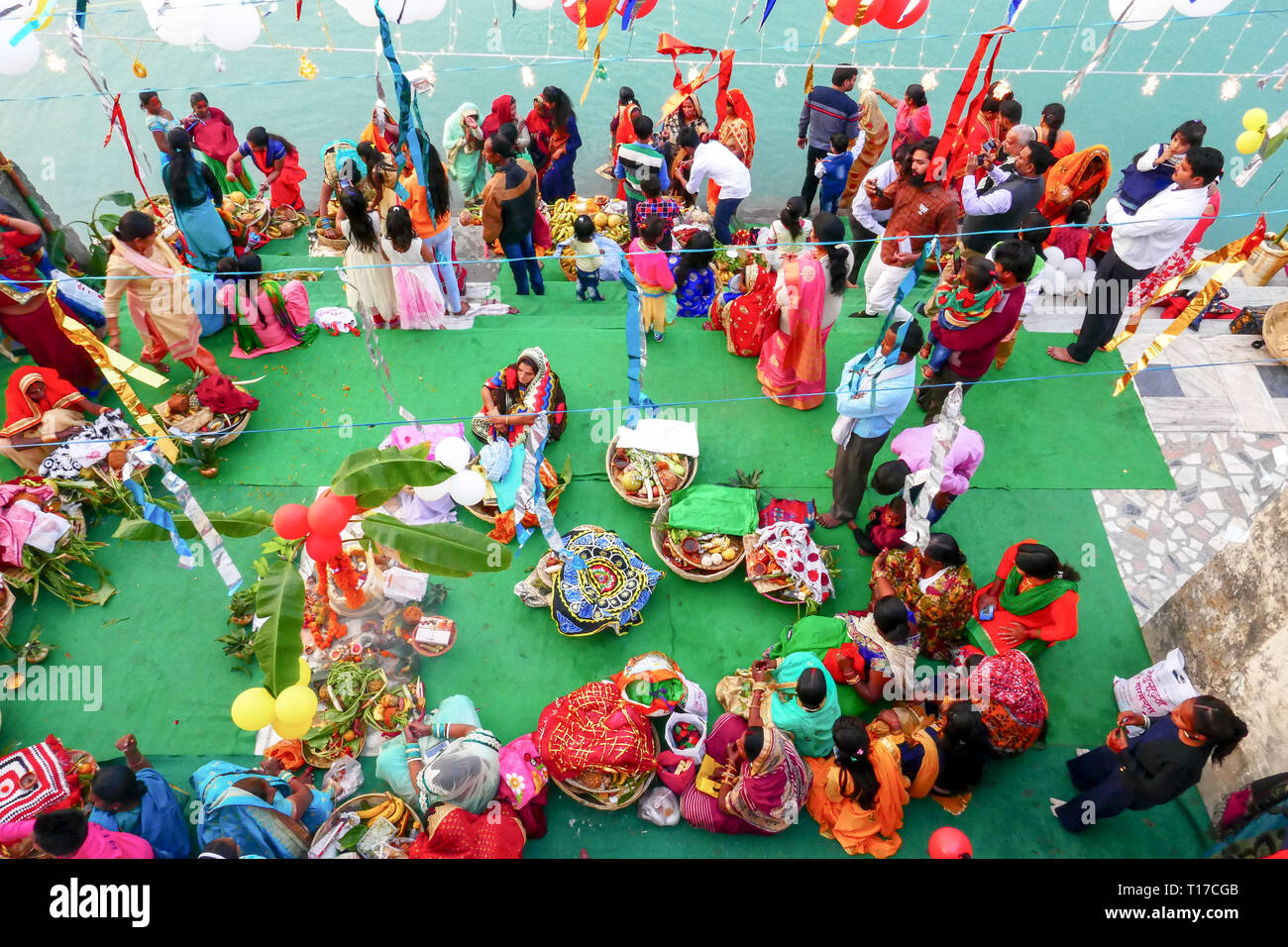 women doing holy ritual at Ganga river in Rishikesh,India Stock Photo