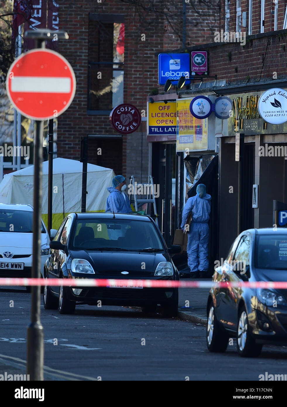 Forensic officers outside Marsh Food and Wine in Marsh Road, Pinner