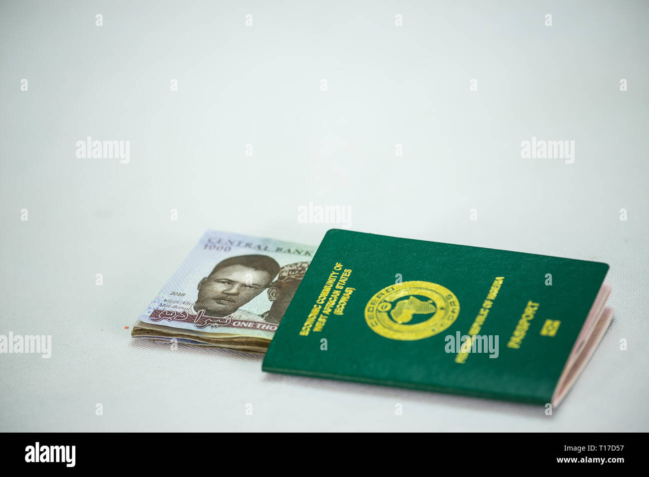 International Passport with local currency notes Stock Photo