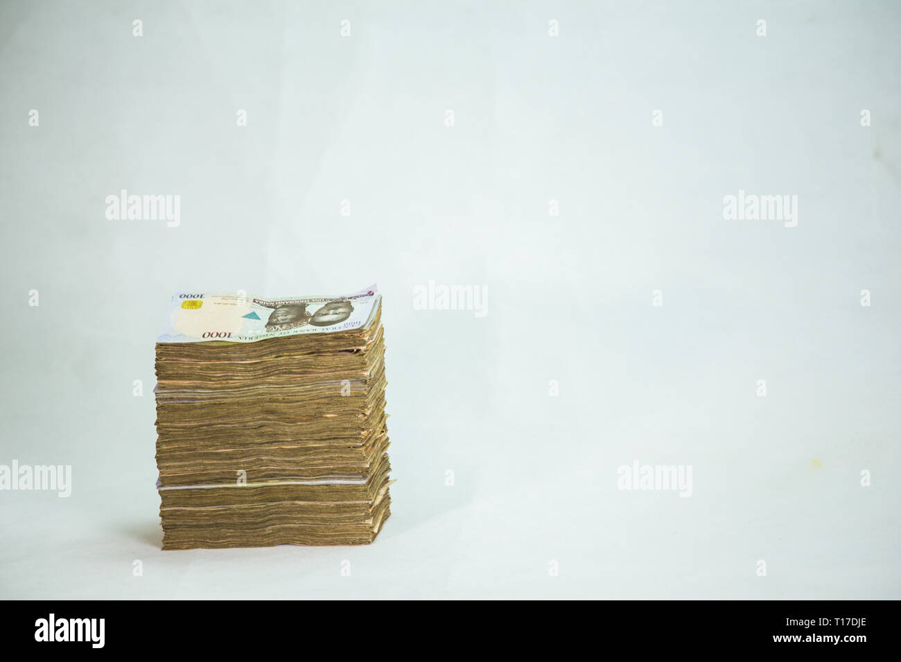 Stack of nigeria naira notes on white background Stock Photo