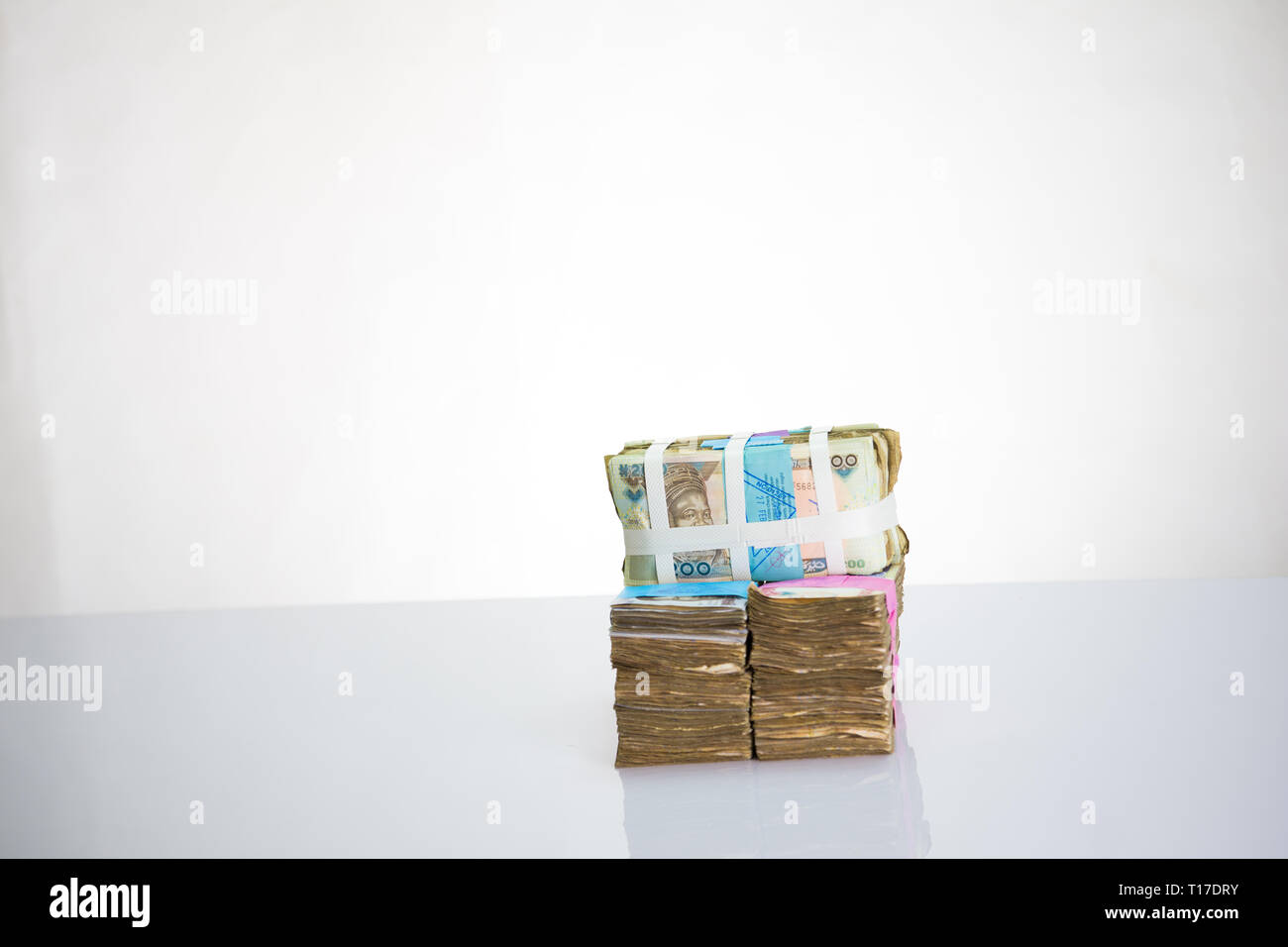 Stack of nigeria naira notes on white background Stock Photo