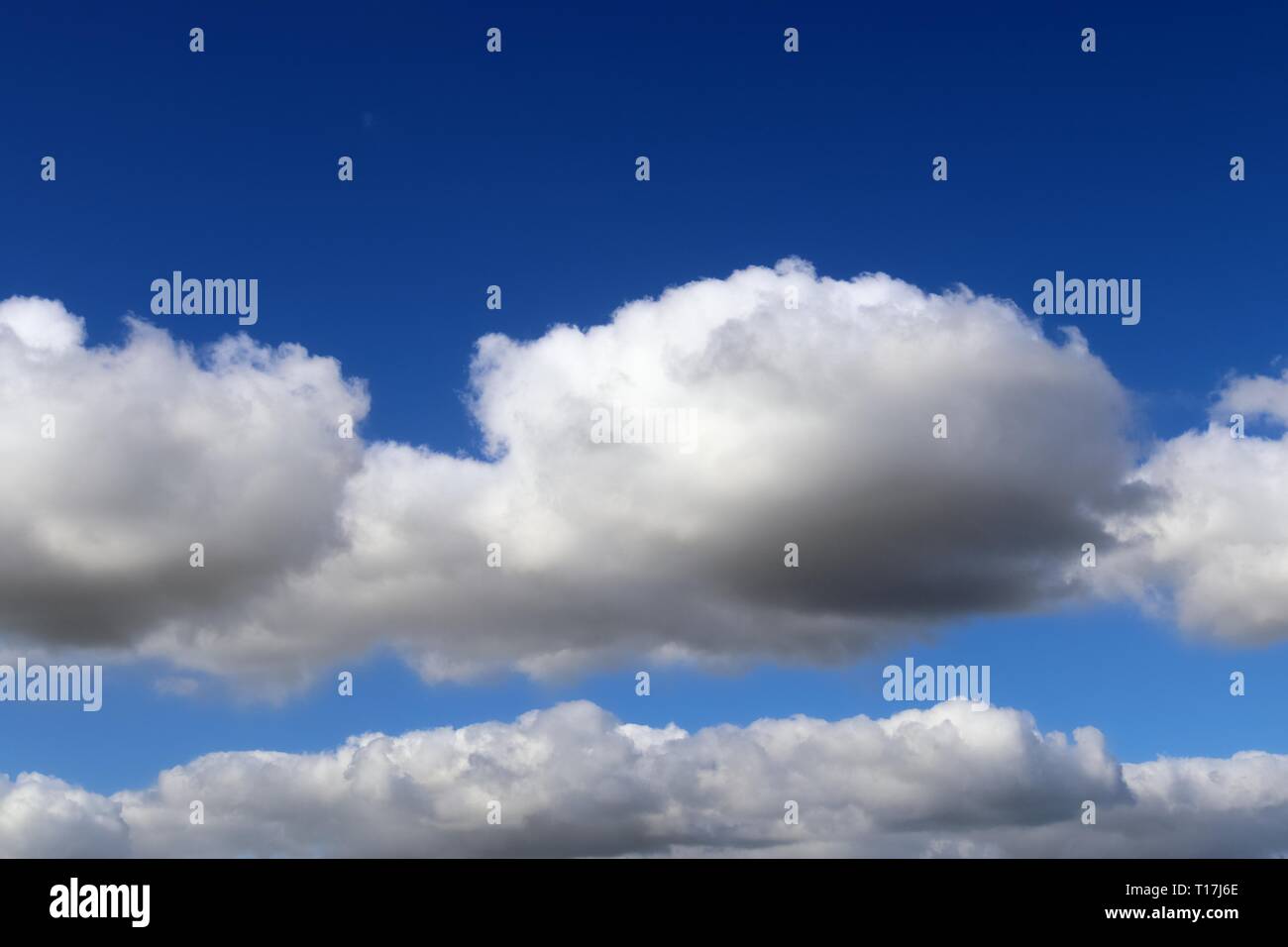 Beautiful white fluffy clouds on a deep blue sky Stock Photo - Alamy