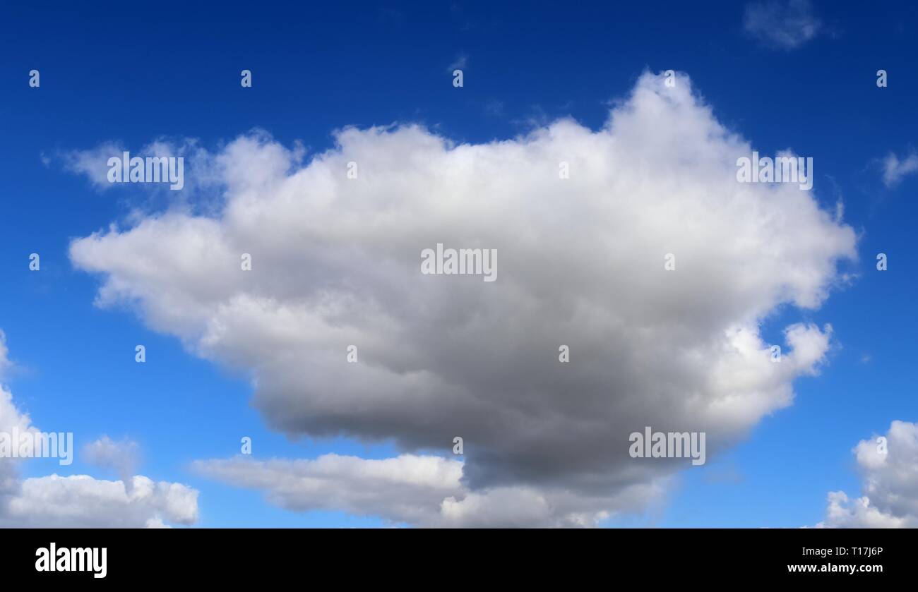 Beautiful white fluffy clouds on a deep blue sky Stock Photo - Alamy