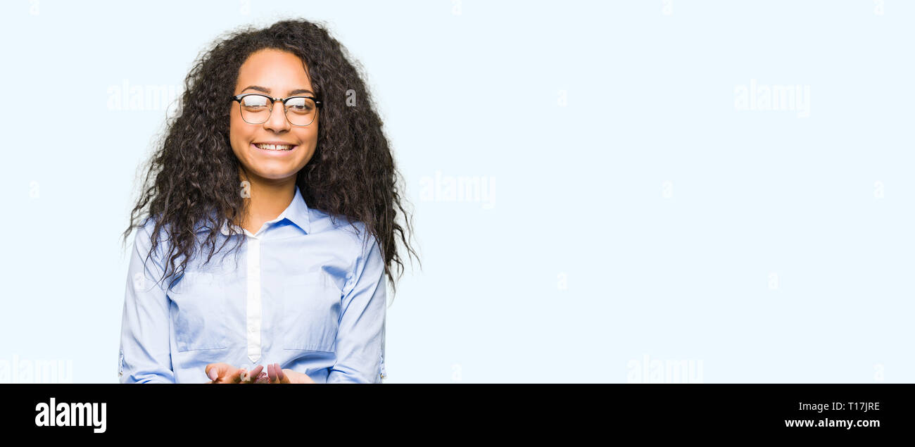 Young beautiful business girl with curly hair wearing glasses Smiling ...