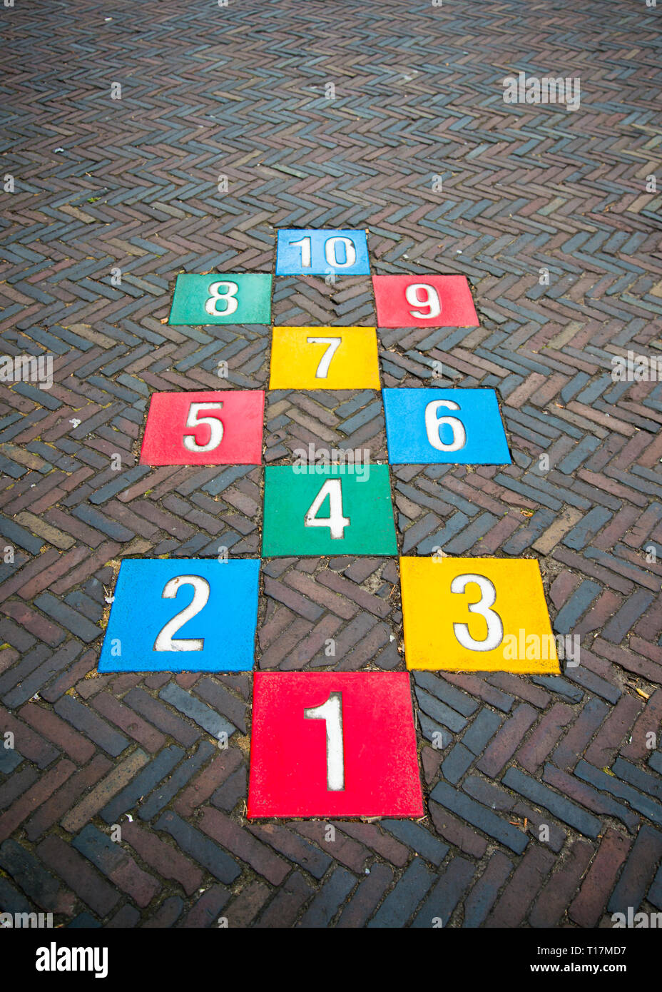 hopscotch numbers painted on to paved street one to ten Stock Photo