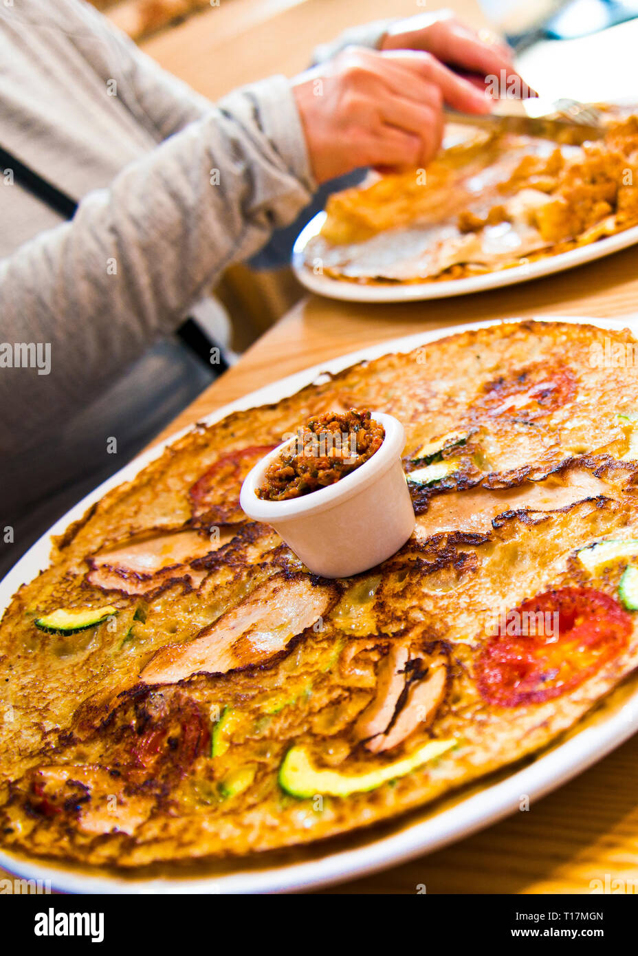 Woman eating food restaurant alone hires stock photography and images Alamy