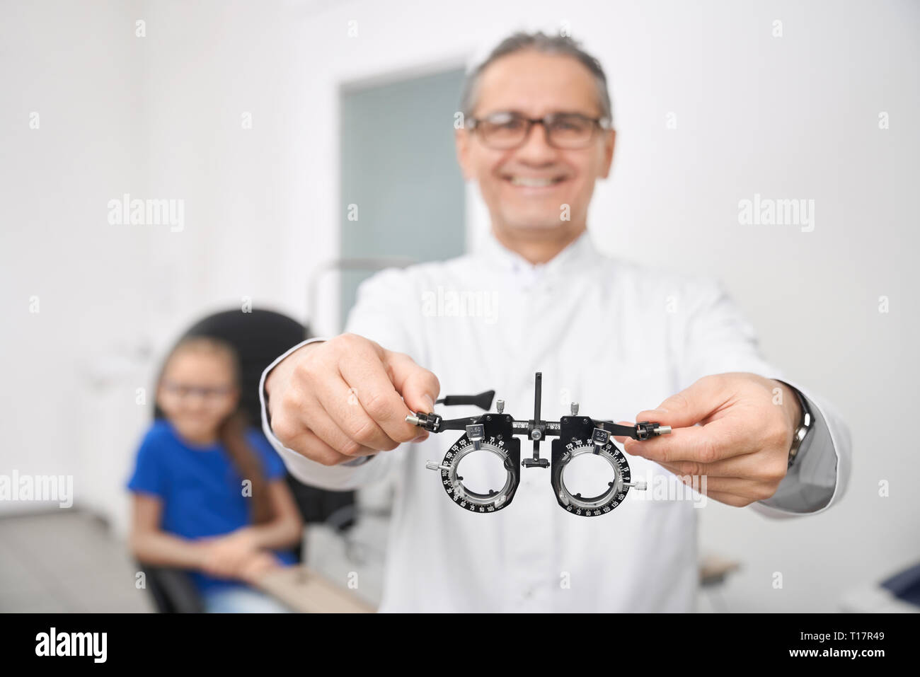 Close up of eye test glasses. Doctor ophthalmologist in white medical