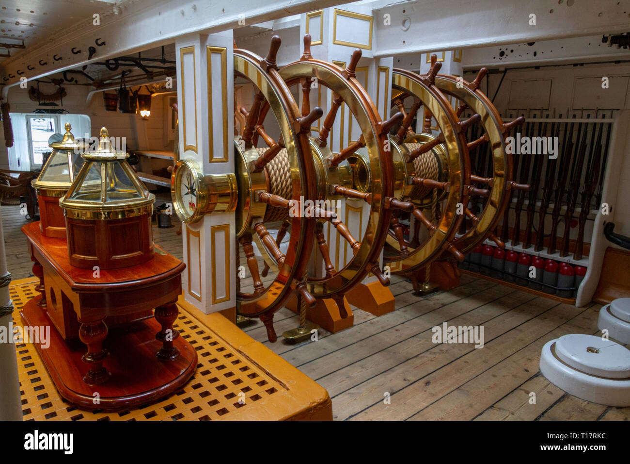 Below deck ship's steering wheels (an additional set of ships wheels was on deck) in the HMS Warrior (1860), Portsmouth Historic Dockyard, UK Stock Photo