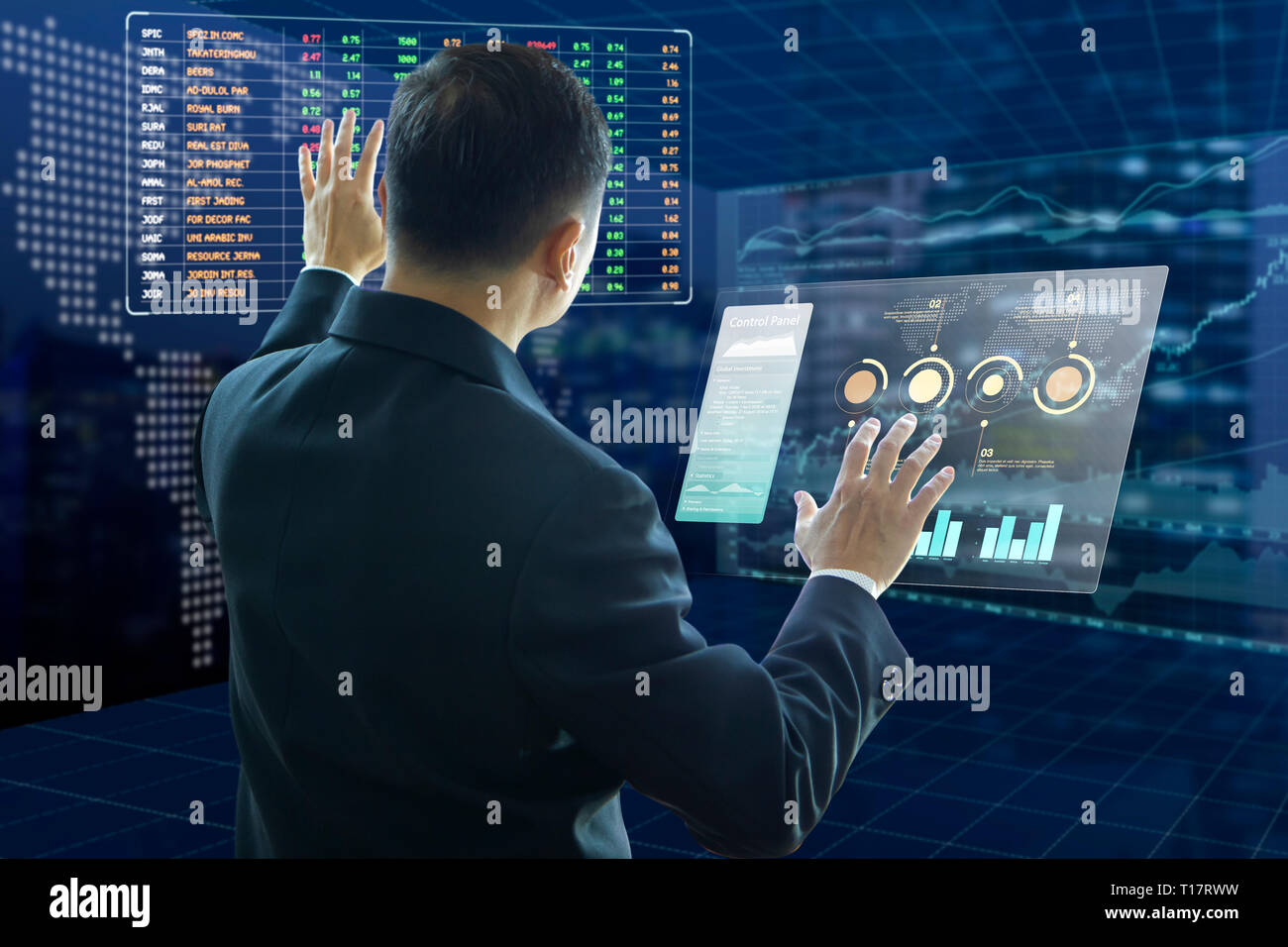 Businessman touches virtual screens analysing on investment risk managment and return on investment, ROI, analysis with fictitious stock symbols. Stock Photo