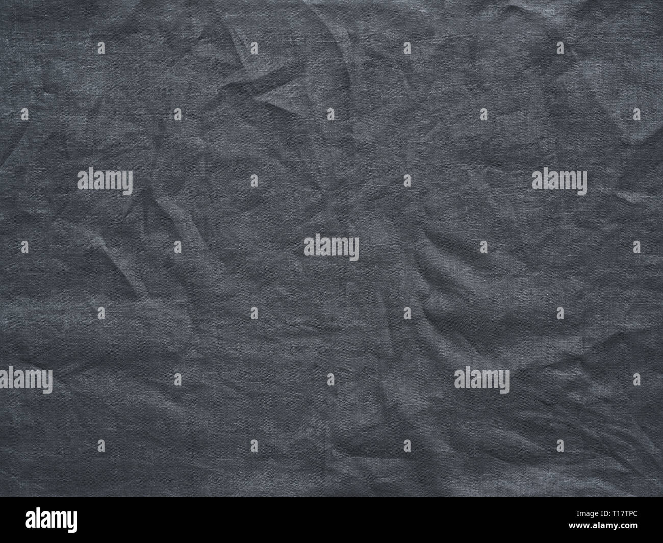 Gray linen texture as background. Gray linen crumpled tablecloth. Can use as mock up for design. Copy space for text Stock Photo