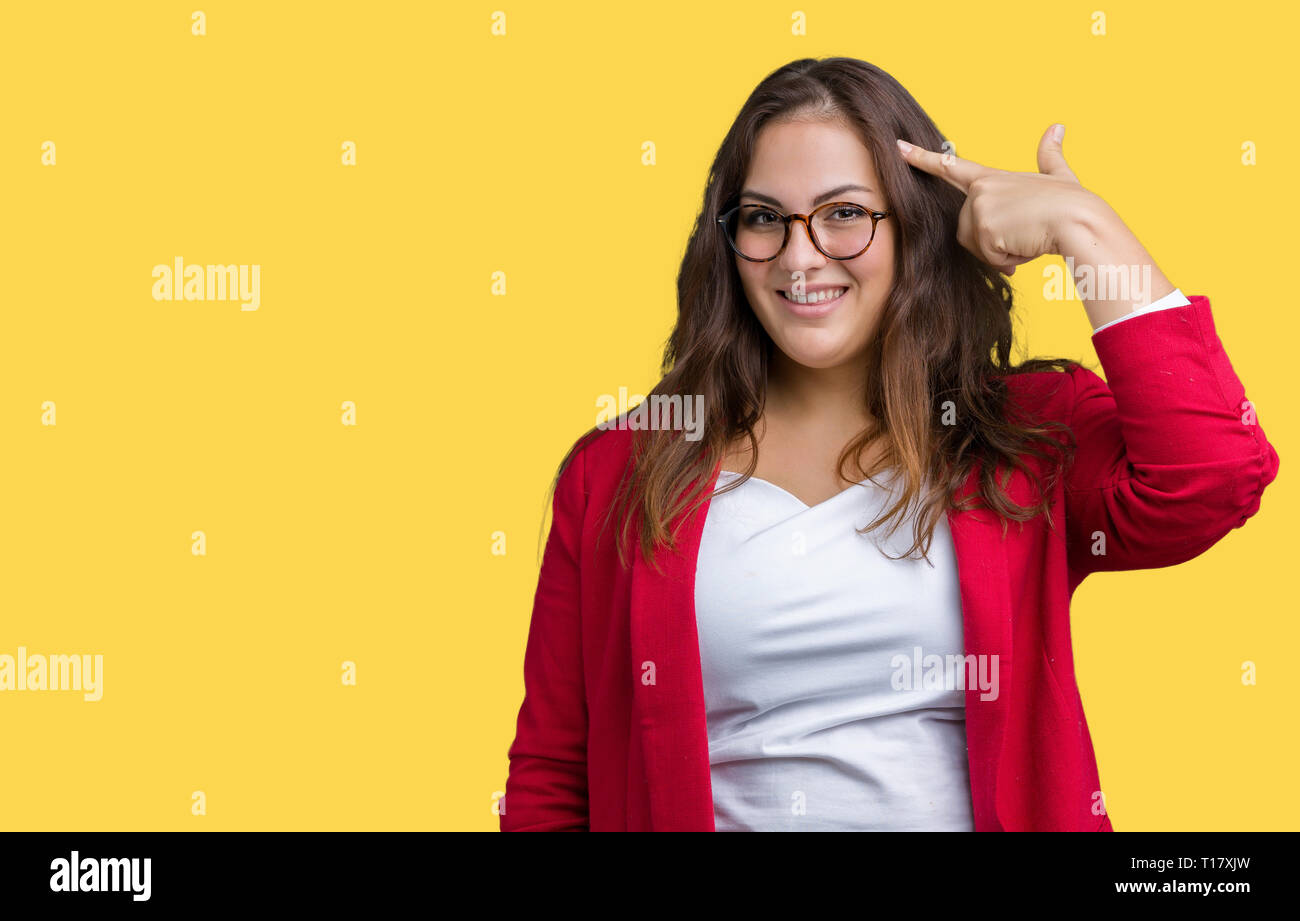 Beautiful plus size young business woman wearing elegant jacket and glasses over isolated background Smiling pointing to head with one finger, great i Stock Photo