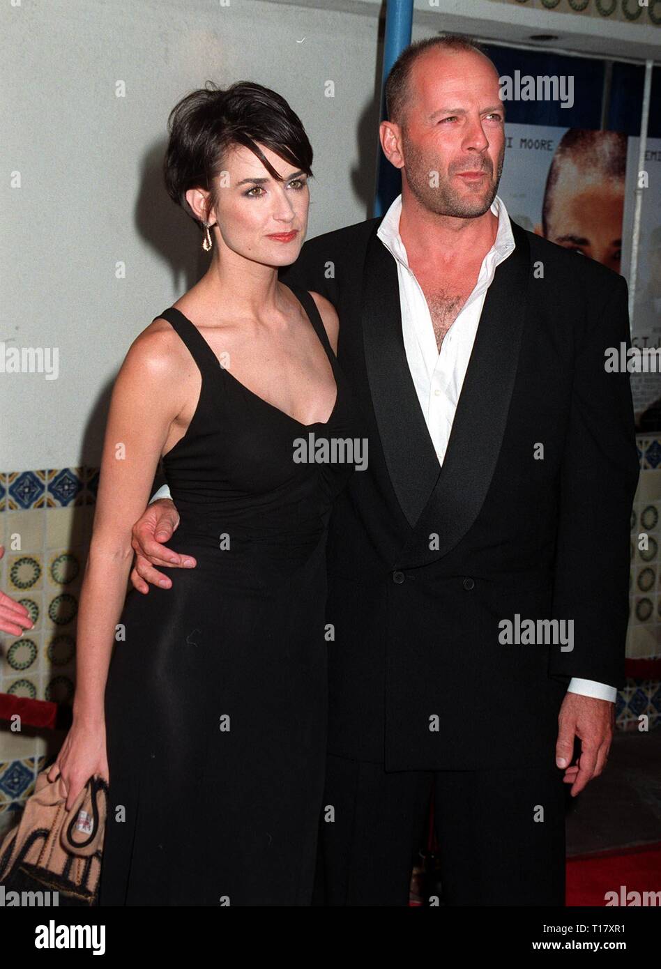LOS ANGELES, CA. August 06, 1997: Actress Demi Moore & husband Bruce Willis at the premiere, in Los Angeles, of her new movie, 'G.I. Jane.' Stock Photo