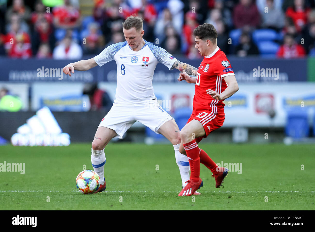 Cardiff, UK. 24th Mar, 2019. Ondrej Duda of Slovakia is challenged by Dan James of Wales during the 2020 UEFA Euro Qualifier group E match between Wales and Slovakia at  the Cardiff City Stadium, Cardiff, Wales on 24 March 2019. Photo by Ken Sparks.  Editorial use only, license required for commercial use. No use in betting, games or a single club/league/player publications. Credit: UK Sports Pics Ltd/Alamy Live News Stock Photo