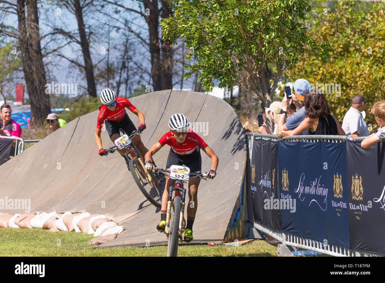 Paarl, South Africa.  24th March, 2019.  Maja Wloszczowska of Poland and Ariane Luthi of Switzerland both of team Kross-Spur Racing sprinting down the final stretch towards the end line earlier today in Paarl and to finish third in one of the toughest mountain bike races in the world.  Credit: Childa Santrucek/Alamy Live News Stock Photo