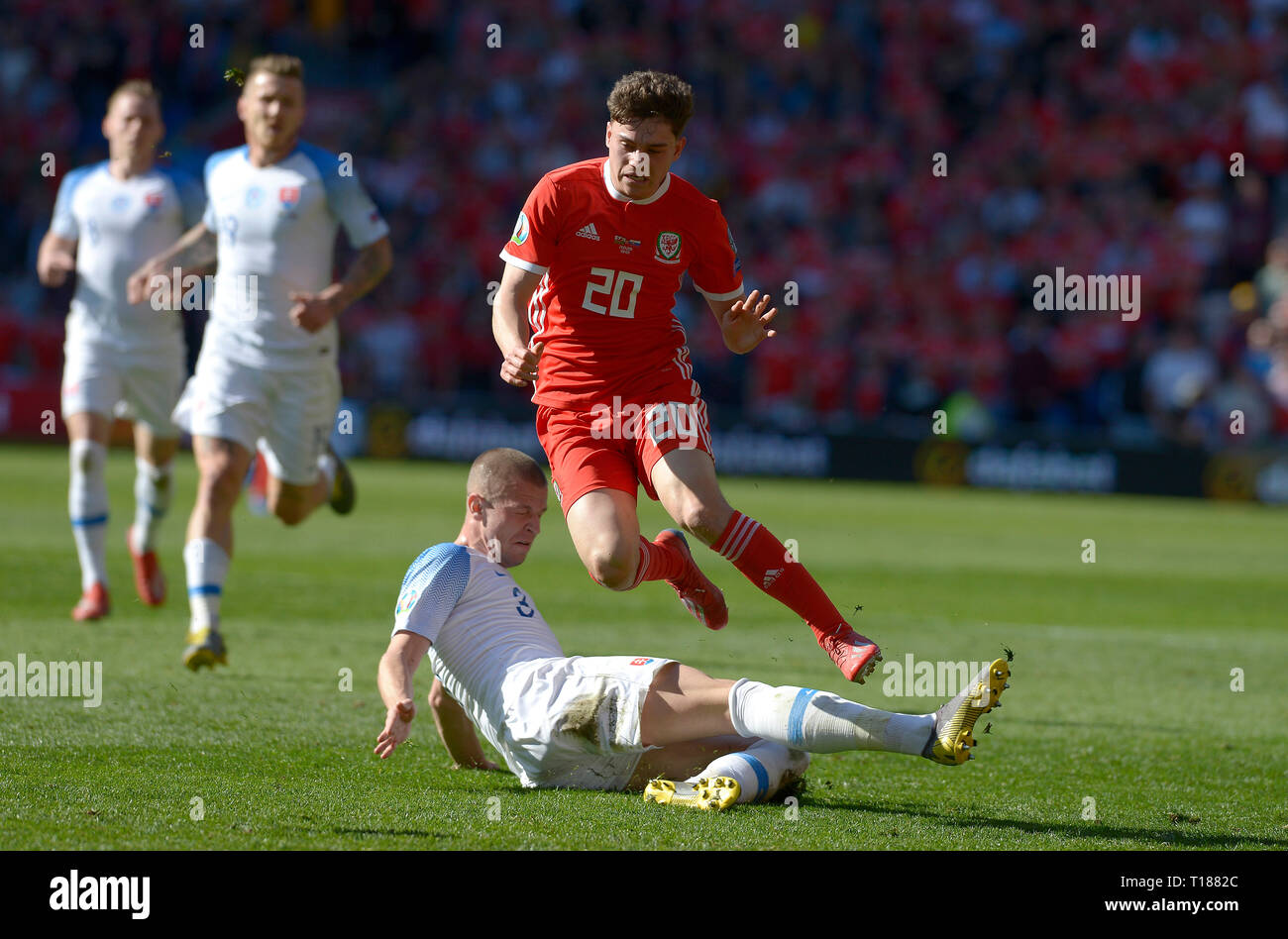 Cardiff, Wales, UK. 24th Mar 2019. Football, UEFA European Qualifiers Group E, Wales v Slovakia, 24/03/19, Cardiff City Stadium, K.O 2PM  Wales' Daniel James is fouled by Slovakia's Denis Vavro  Andrew Dowling Credit: Andrew Dowling/Influential Photography/Alamy Live News Stock Photo