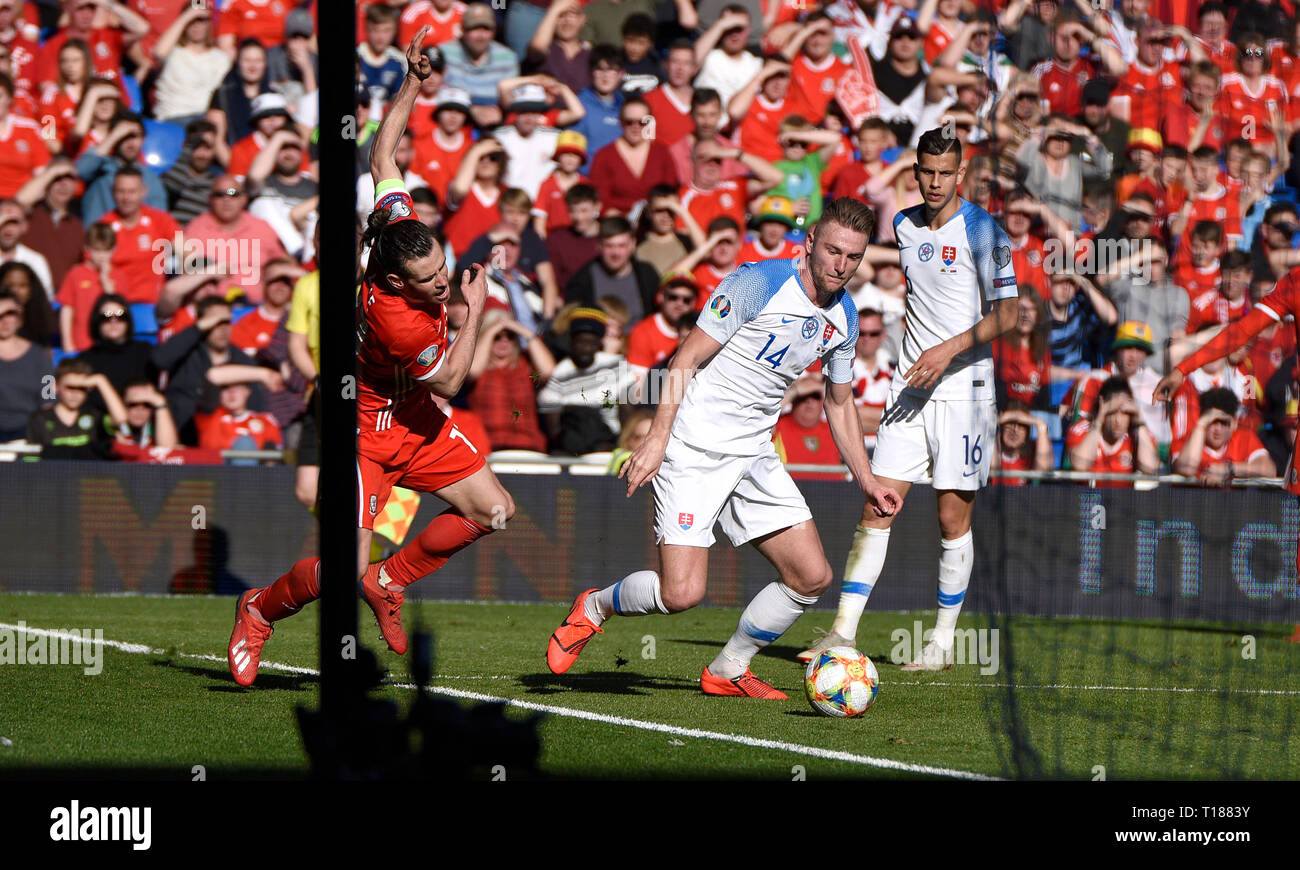 Cardiff, Wales, UK. 24th Mar 2019. Football, UEFA European Qualifiers Group E, Wales v Slovakia, 24/03/19, Cardiff City Stadium, K.O 2PM  Wales'  Gareth Bale appeals for a penalty after Slovakia's Milan Skriniar pushes him in the chest  Andrew Dowling Credit: Andrew Dowling/Influential Photography/Alamy Live News Stock Photo