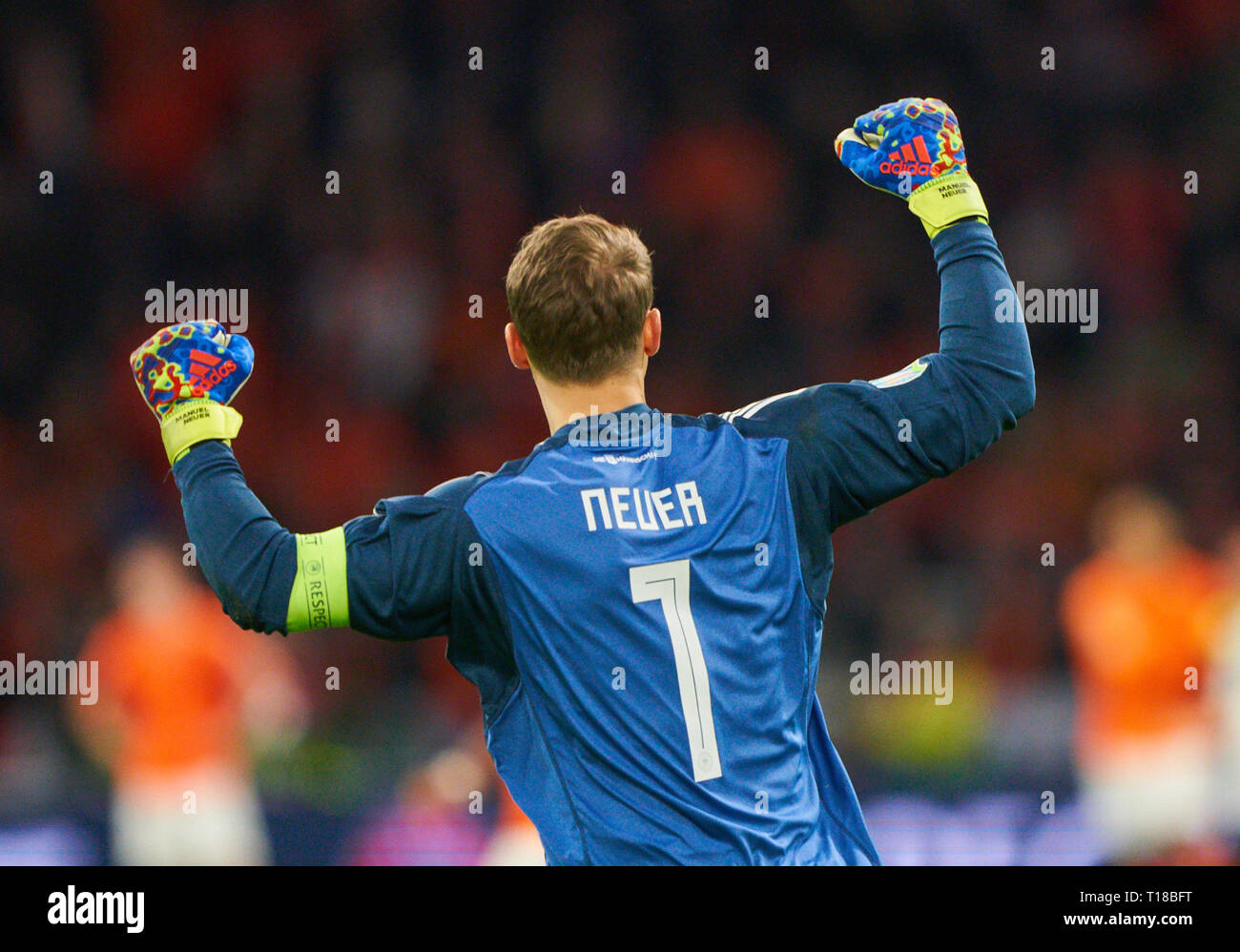 Amsterdam, Netherlands. 24th Mar, 2019. Manuel NEUER, DFB 1 goalkeeper, Cheering, joy, emotions, celebrating, laughing, cheering, rejoice, tearing up the arms, clenching the fist, celebrate, celebration, Nico SCHULZ, DFB 14 scores, shoots goal for 2-3 NETHERLANDS - GERMANY Important: DFB regulations prohibit any use of photographs as image sequences and/or quasi-video. Qualification for European Championships, EM Quali, 2020 Season 2018/2019, March 24, 2019 in Amsterdam, Netherlands. Credit: Peter Schatz/Alamy Live News Stock Photo
