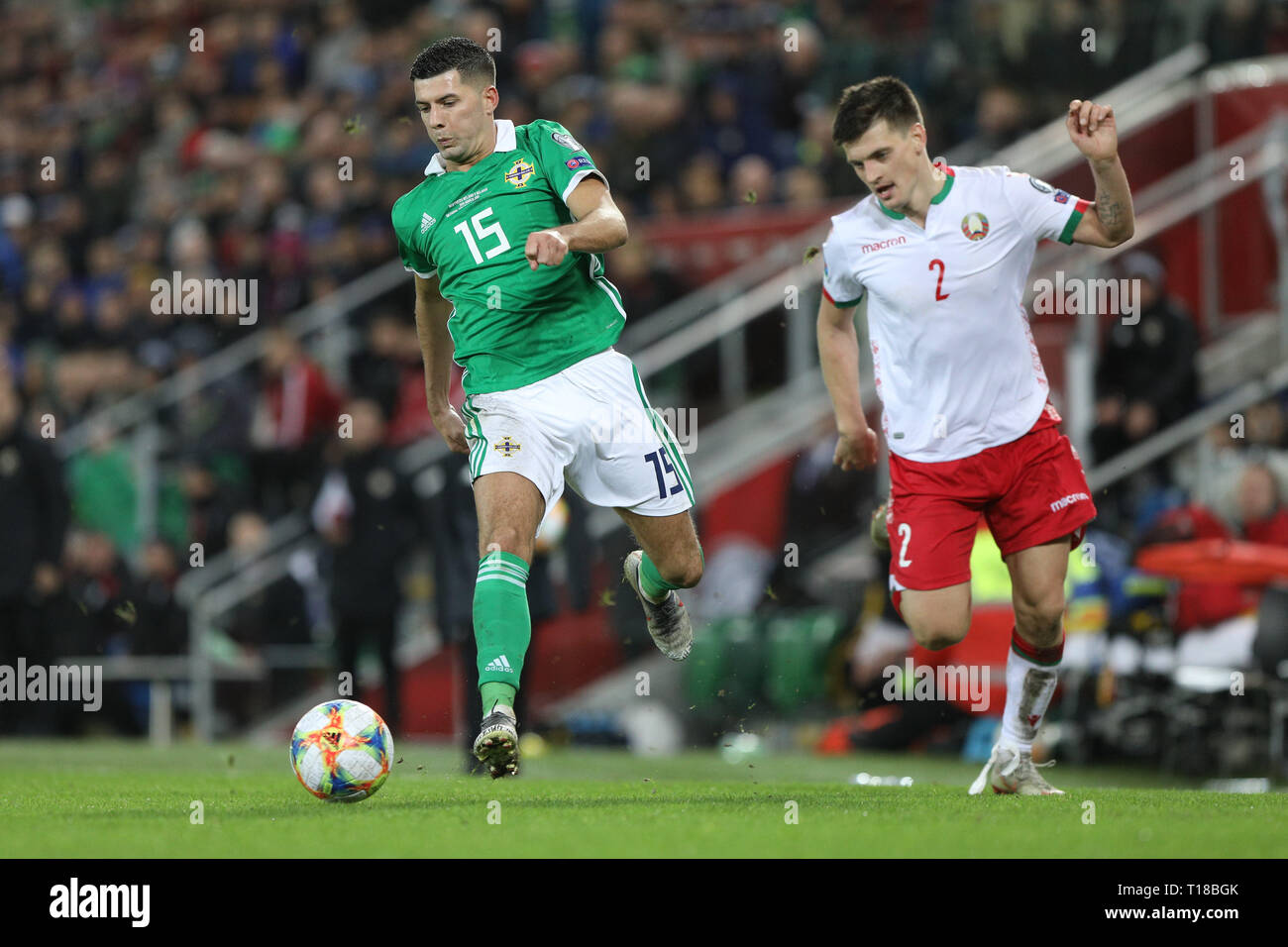 Windsor Park, Belfast, Northern Ireland. 24th Mar, 2019. UEFA European Championships Qualification football, Northern Ireland versus Belarus; Northern Ireland's Jordan Jones pushes past Stanislav Dragun of Belarus Credit: Action Plus Sports/Alamy Live News Stock Photo