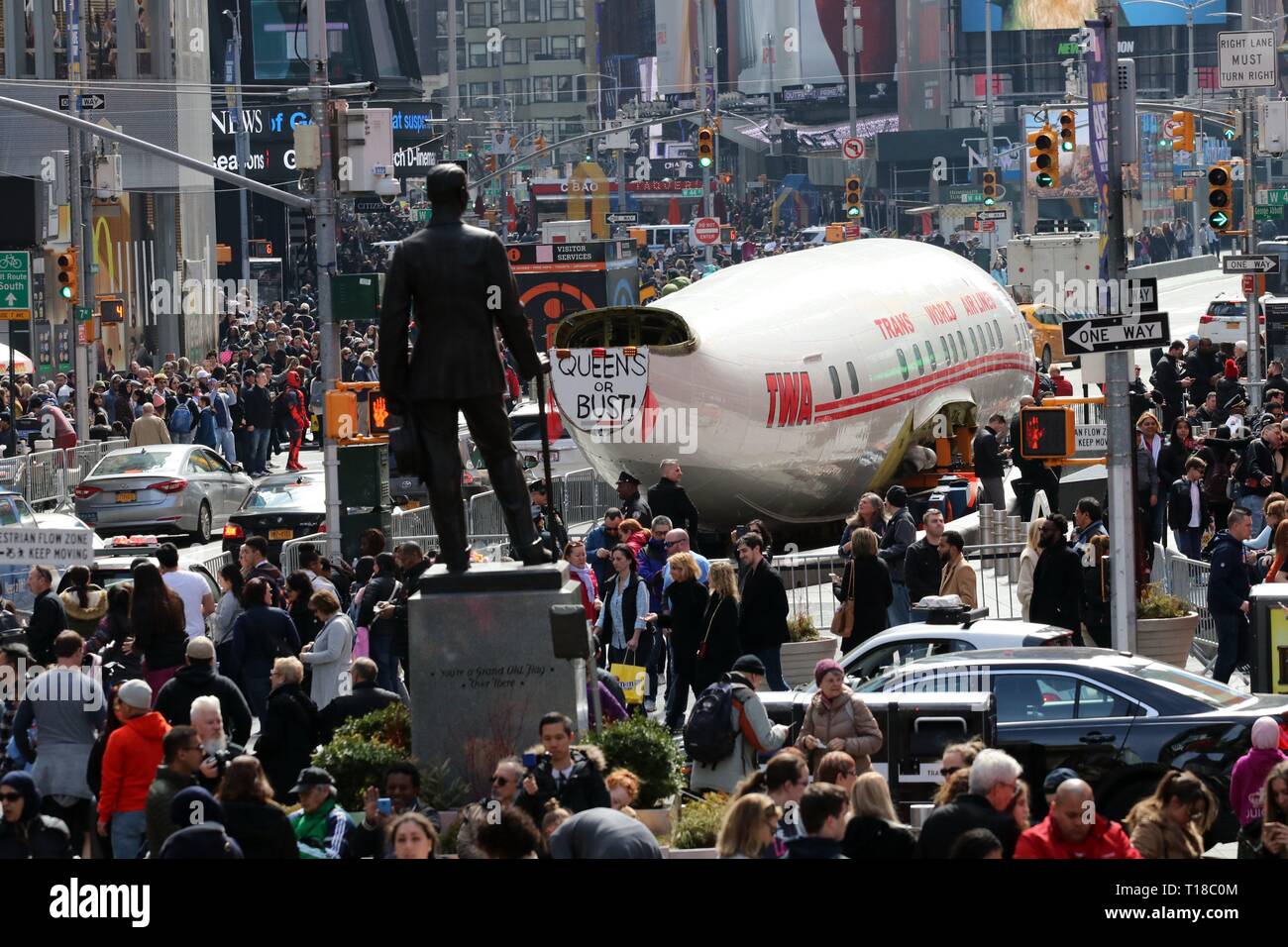 New York, USA. 24th March, 2019. A Lockheed Constellation plane know as 'Connie' has rolled  into Times Square, New York. The plane was built for Trans World Airlines, commissioned by the late recluse billionaire Howard Hughes in 1939. Hughes broke the trans -continental flight record, from Burbank, California to New York in 1946 piloting the plane which was delivered to TWA in 1958. After a checked past the aircraft final destination is JFK Airport and is to be transformed into a cocktail lounge at the newly refurnished TWA Flight Center hotel. © 2019 Credit: G. Ronald Lopez/Alamy Live News Stock Photo