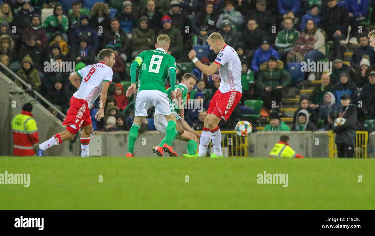 National Football Stadium at Windsor Park, Belfast, Northern Ireland. 24  March 2019. UEFA EURO 2020 Qualifier- Northern Ireland v Belarus. Action from tonight's game. Jonny Evans makes the tackle for Northern Ireland. Credit: David Hunter/Alamy Live News. Stock Photo