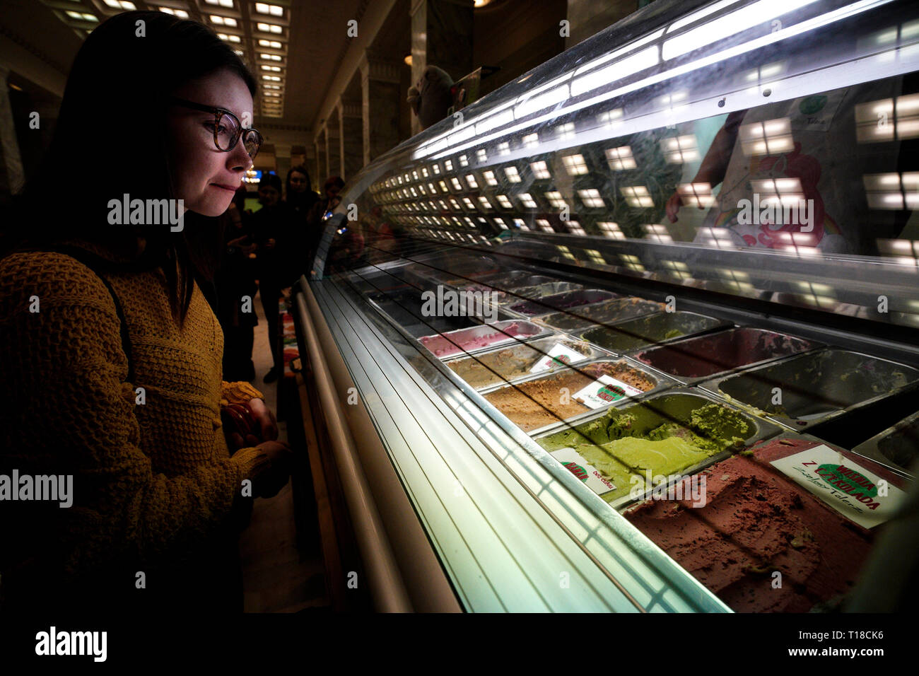 Warsaw, Poland. 24th Mar, 2019. A woman selects vegan ice cream during the Vegan Food Festival in Warsaw, Poland, on March 24, 2019. Credit: Jaap Arriens/Xinhua/Alamy Live News Stock Photo