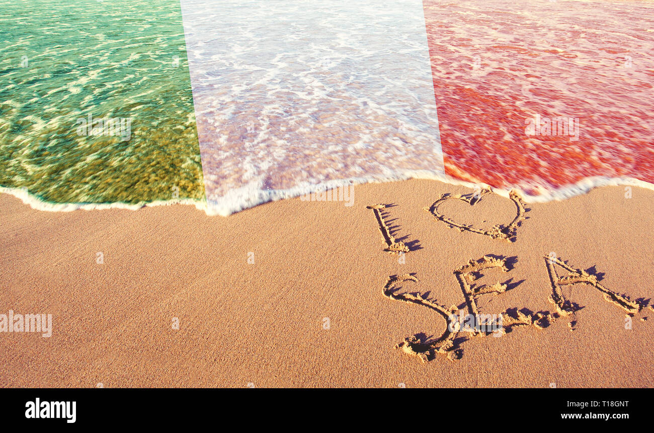 Beach sand, sea and flag Italy. I love Italy concept Stock Photo