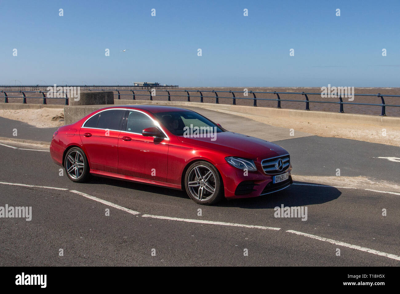 Mercedes-Benz E 220 D SE Auto driving on the seafront promenade, Marine Drive, Southport, Merseyside, UK Stock Photo