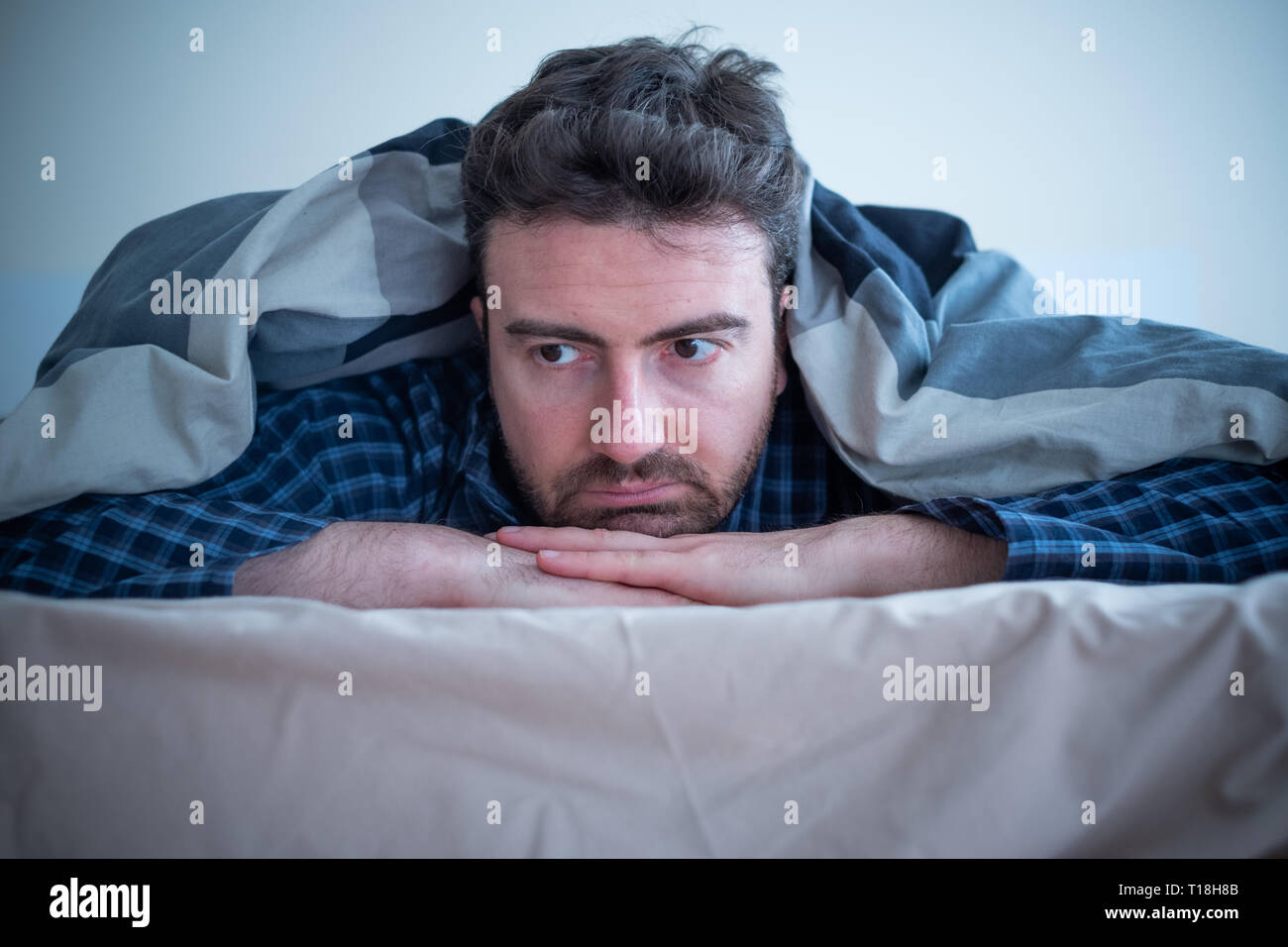 Man with sleep disorder lying in the bed Stock Photo Alamy