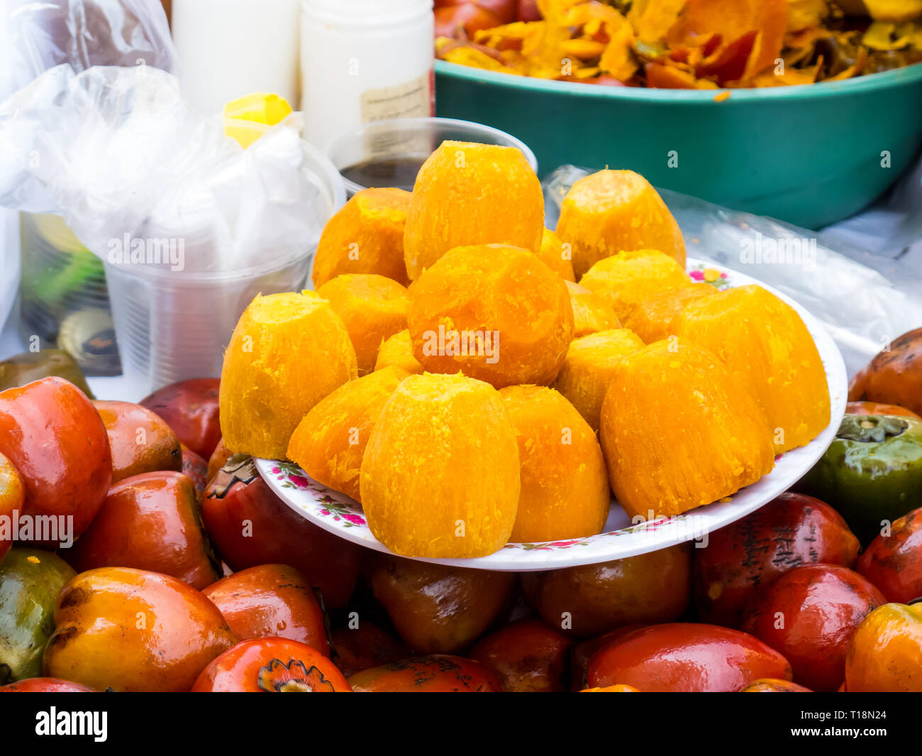 Street selling of an exotic tropical fruit called chontaduro (Bactris  gasipaes Stock Photo - Alamy