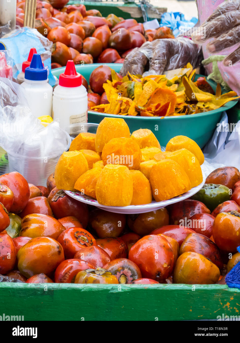 Street selling of an exotic tropical fruit called chontaduro (Bactris  gasipaes Stock Photo - Alamy