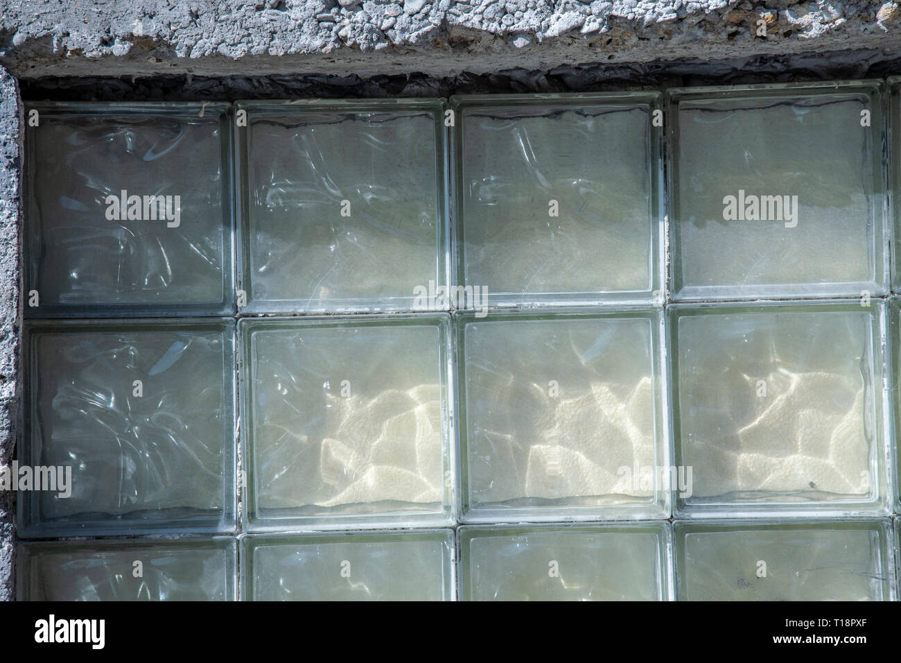 Square glass blocks on a house wall Stock Photo