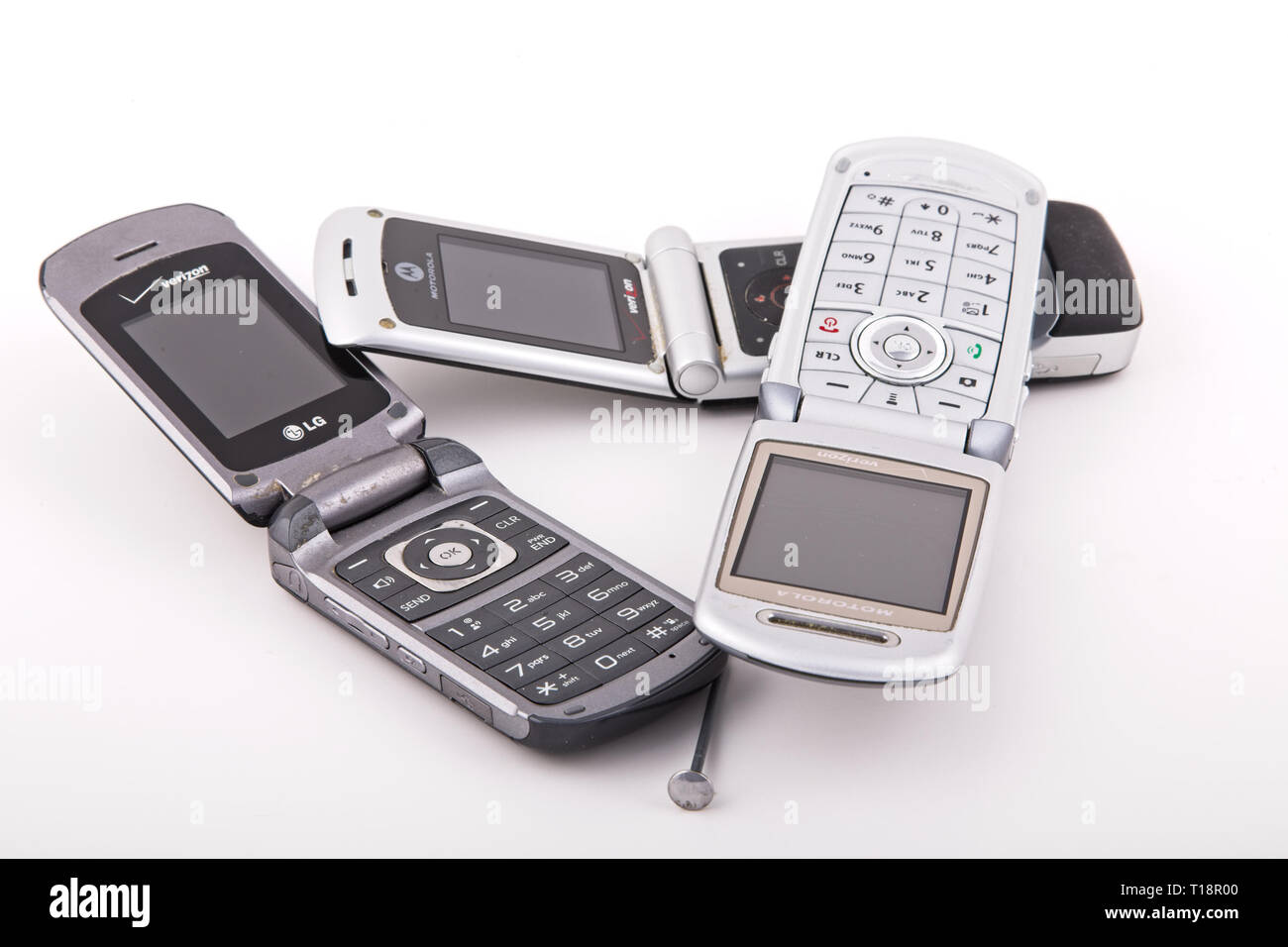 Old Classic Flip Style Cell Phones on White Stock Photo