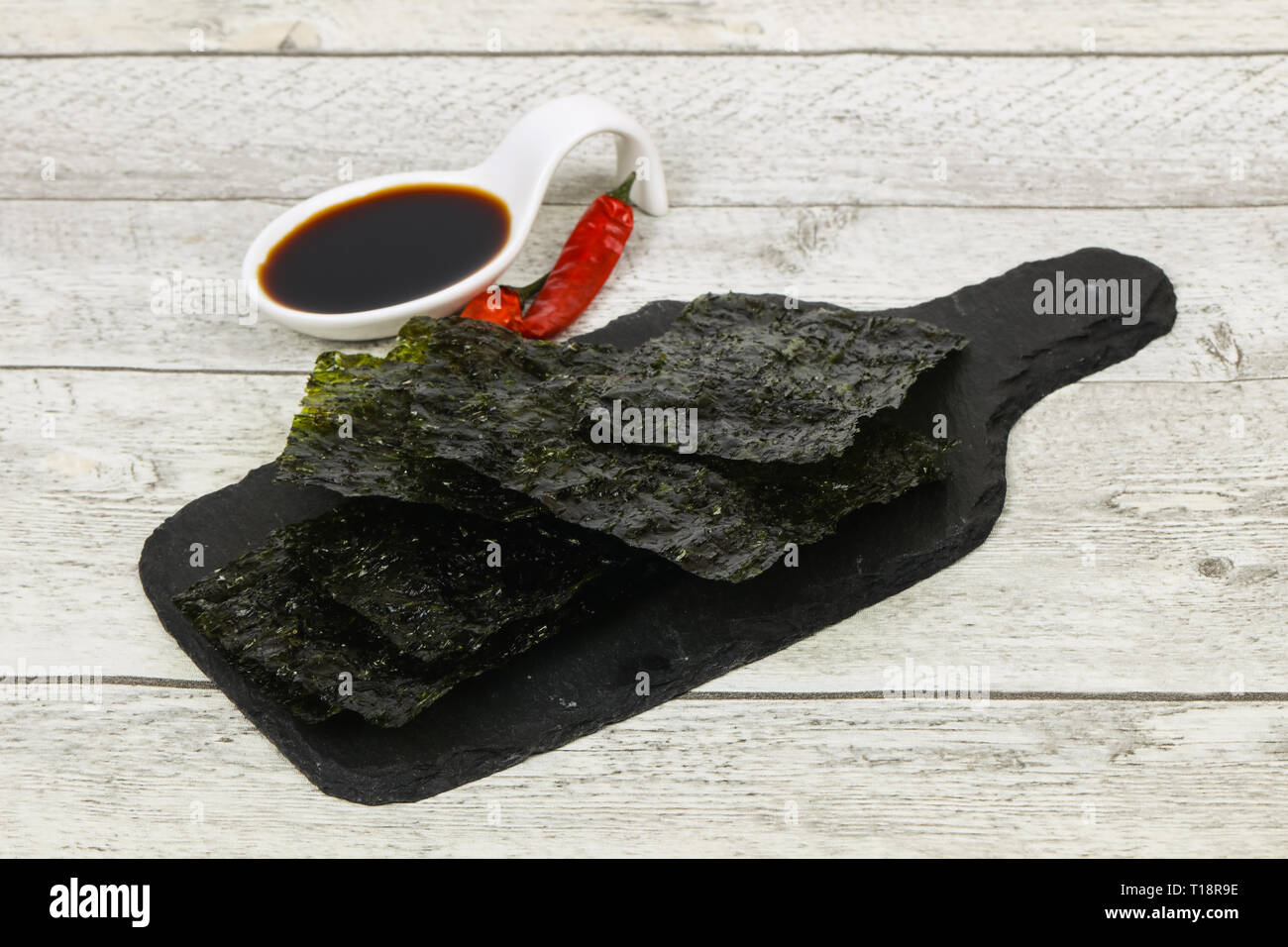 Tasty Nori chips with soya sauce Stock Photo Alamy
