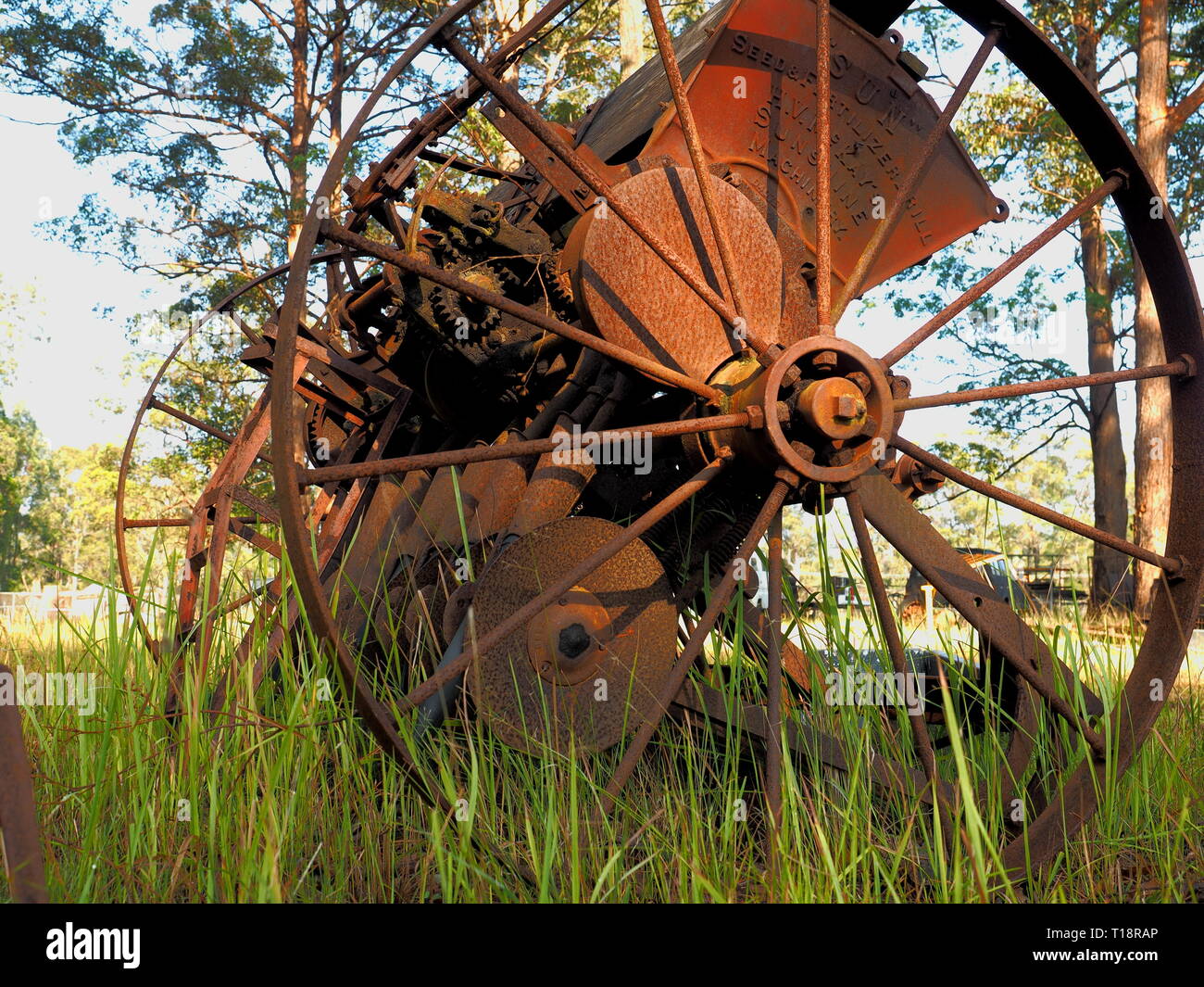 Old farming equipment from days gone by. Rusting in the paddock the old machinery is no longer used. Stock Photo